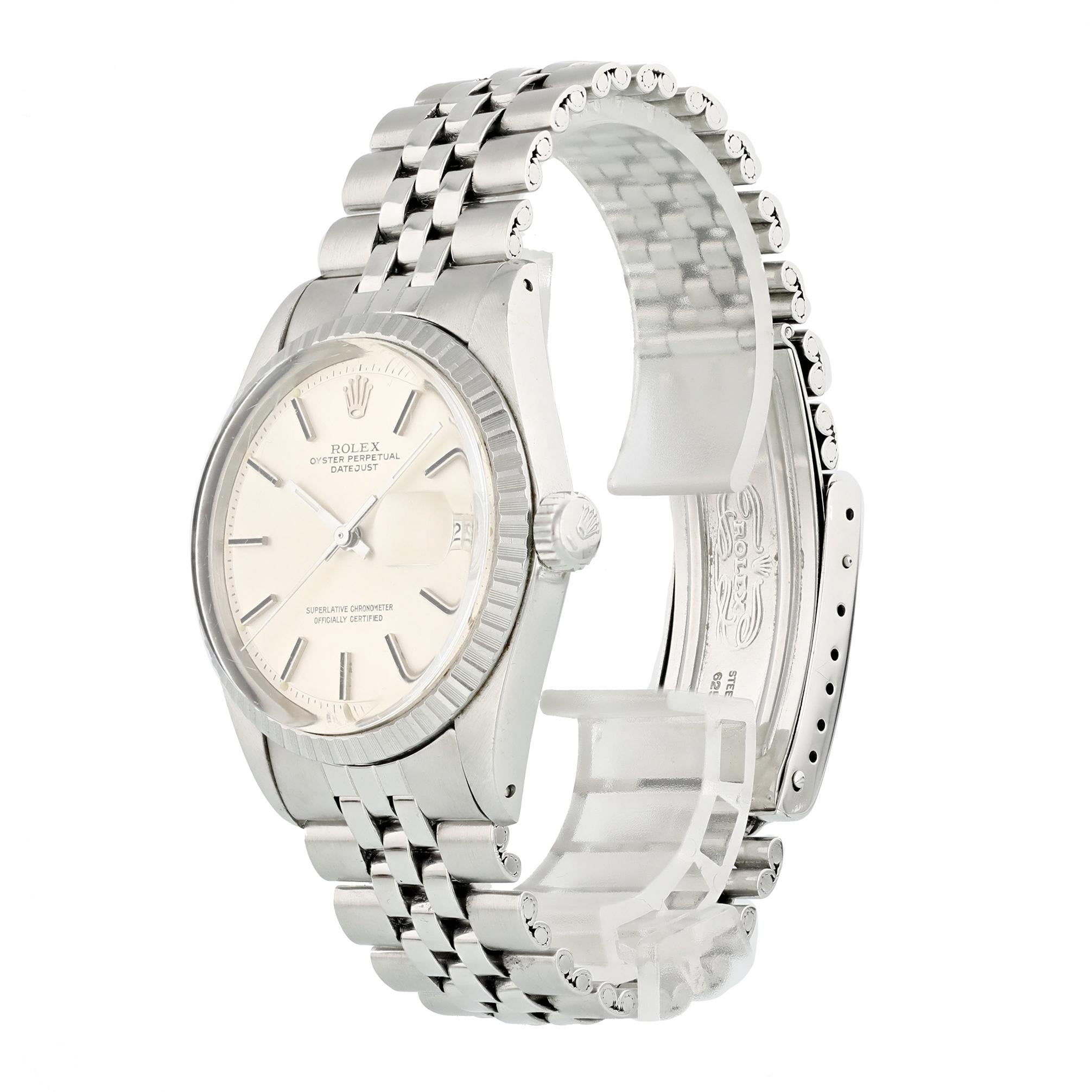 Rolex Datejust 1603 Men Watch. 
36mm Stainless Steel case. 
Stainless Steel Stationary bezel. 
Silver dial with Steel hands and index hour markers. 
Minute markers on the outer dial. 
Date display at the 3 o'clock position. 
Stainless Steel old