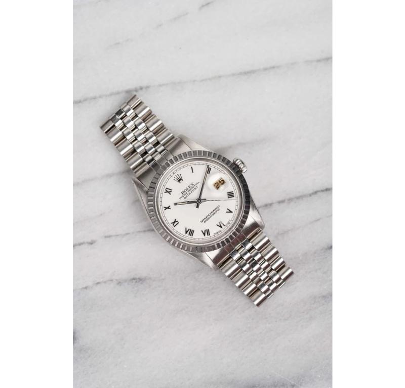 Here's a vintage Rolex Datejust reference 16030 (steel bezel) automatic with a white Roman numeral dial on a jubilee bracelet from the 80s. Keeps great time and is fully functional. Measurements include a 36mm oyster case and 20mm lug width. It's on