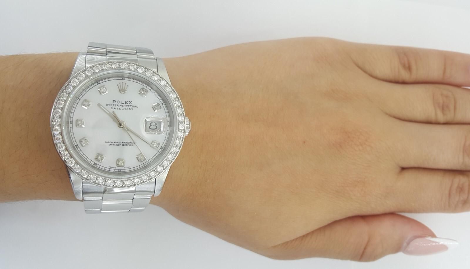 Rolex DateJust 16200 36mm –  Mother of Pearl Diamond Dial & Diamond Bezel (Y Serial, 2002)

This classic 36mm Rolex DateJust, reference 16200, features a stunning aftermarket mother of pearl dial accented with diamond hour markers and an expertly