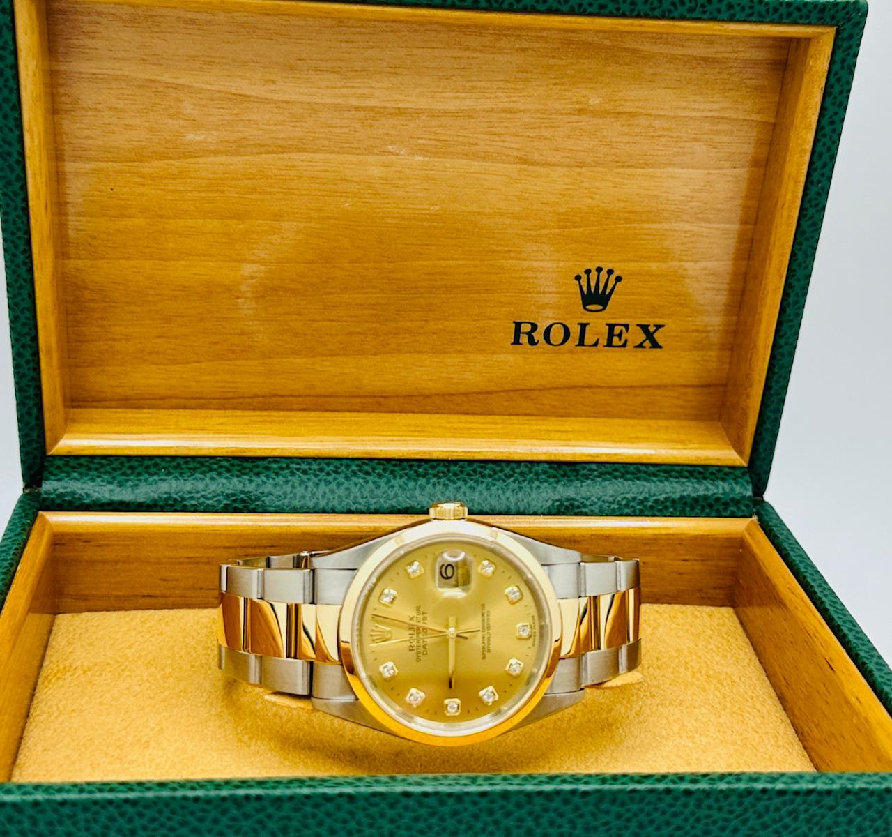 Style Number: 16203

Serial: K816***

Year: 2001

Model: Rolex Datejust

Case Material: Stainless Steel

Band: 18K Yellow Gold & Stainless Steel

Bezel: 18K Yellow Gold

Dial: Factory Original Champagne Diamond Dial

Crystal: Sapphire Crystal

Case