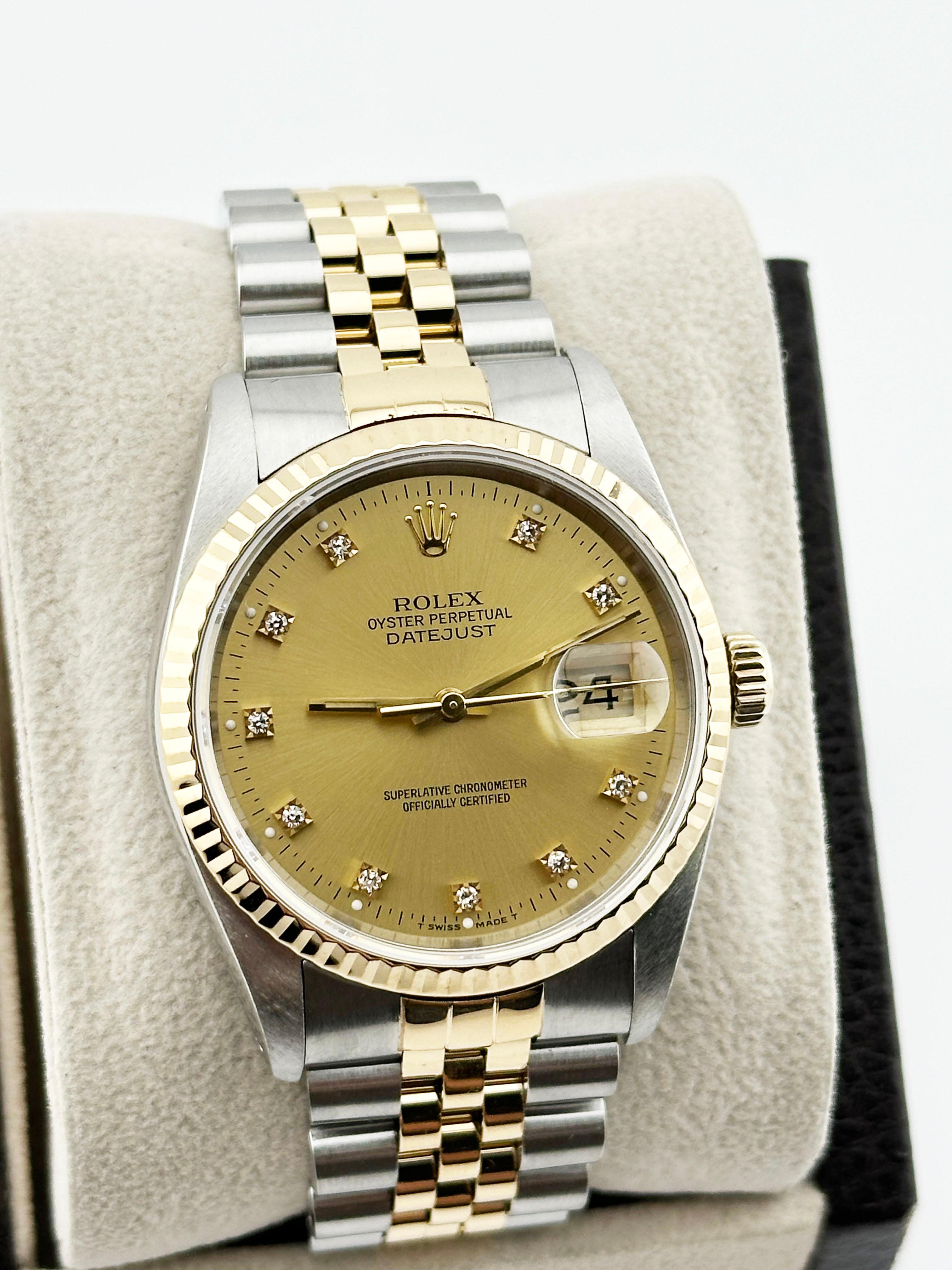 Style Number: 16233

Serial: L875***

Year: 1989

Model: Rolex Datejust

Case Material: Stainless Steel

Band: 18K Yellow Gold & Stainless Steel

Bezel: 18K Yellow Gold

Dial: Champagne Diamond Dial

Face: Sapphire Crystal

Case Size: