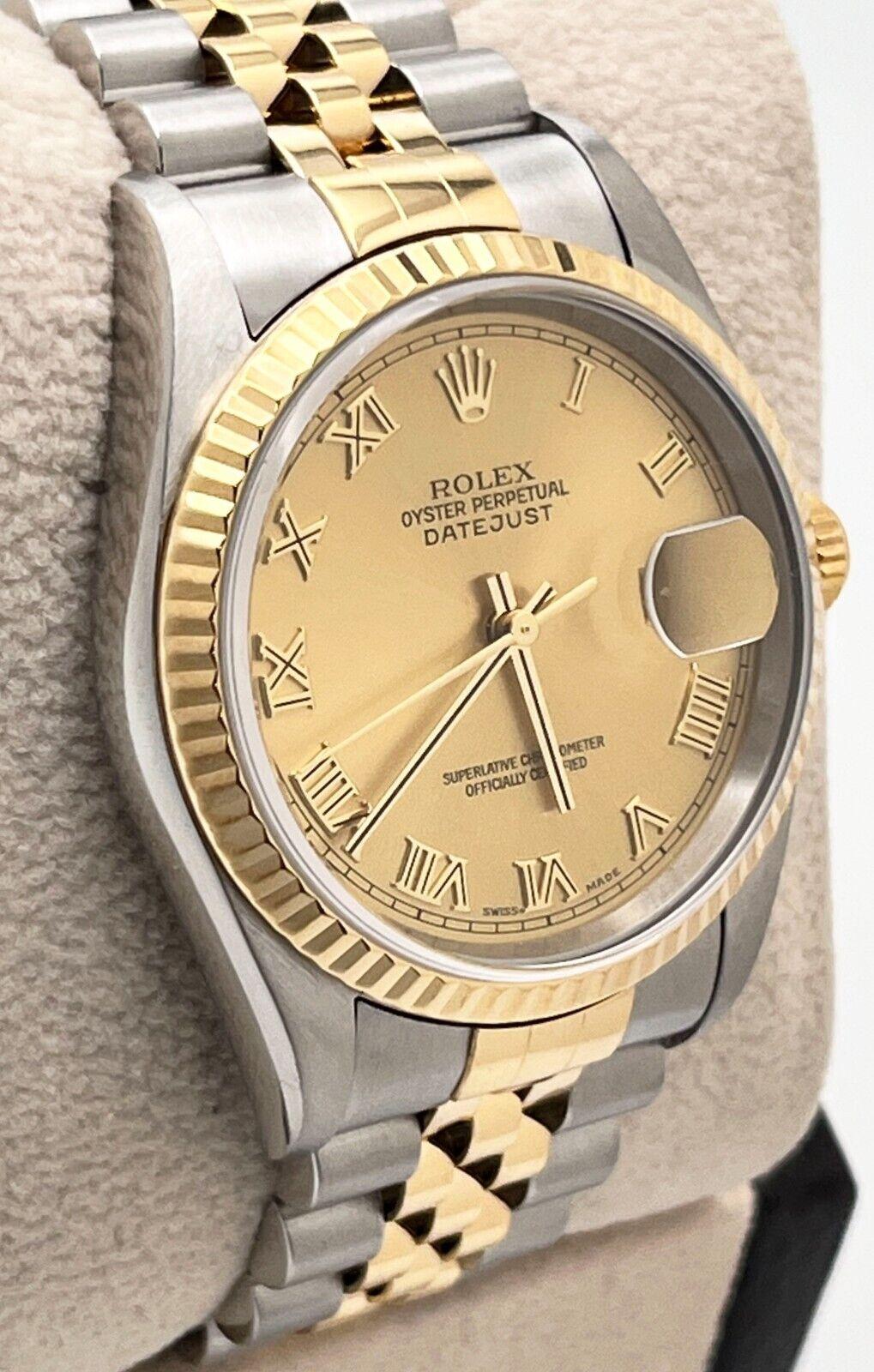 Style Number: 16233
Serial: Y875***
Year: 2004
Model: Datejust
Case Material: Stainless Steel
Band: 18K Yellow Gold & Stainless Steel
Bezel: 18K Yellow Gold
Dial: Champagne Roman Numerals Dial
Face: Sapphire Crystal
Case Size: 36mm
Includes: 
-Rolex