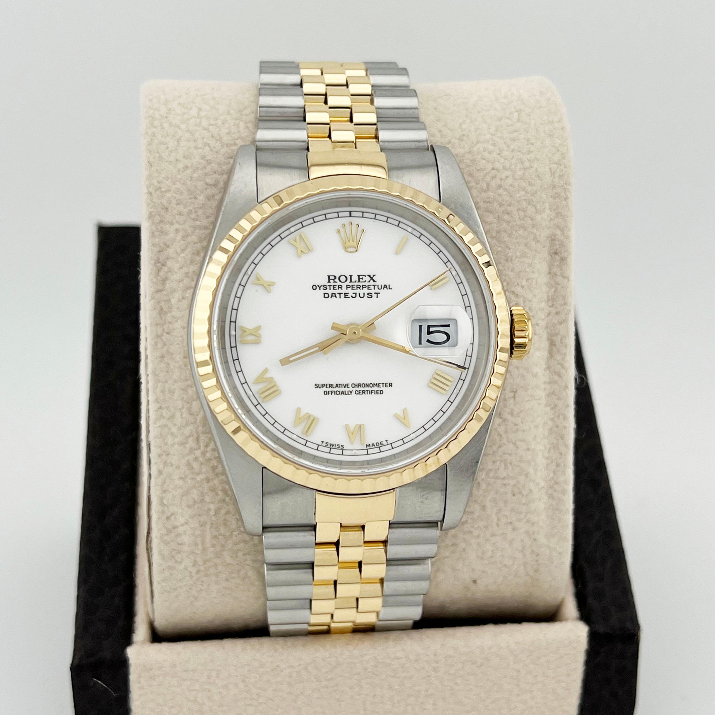 Style Number: 16233

Serial: X795****

Year: 1989

Model: Rolex Datejust

Case Material: Stainless Steel

Band: 18k Yellow Gold & Stainless Steel

Bezel: 18k Yellow Gold Fluted Bezel

Dial: White Roman Numeral Dial

Face: Sapphire Crystal

Case