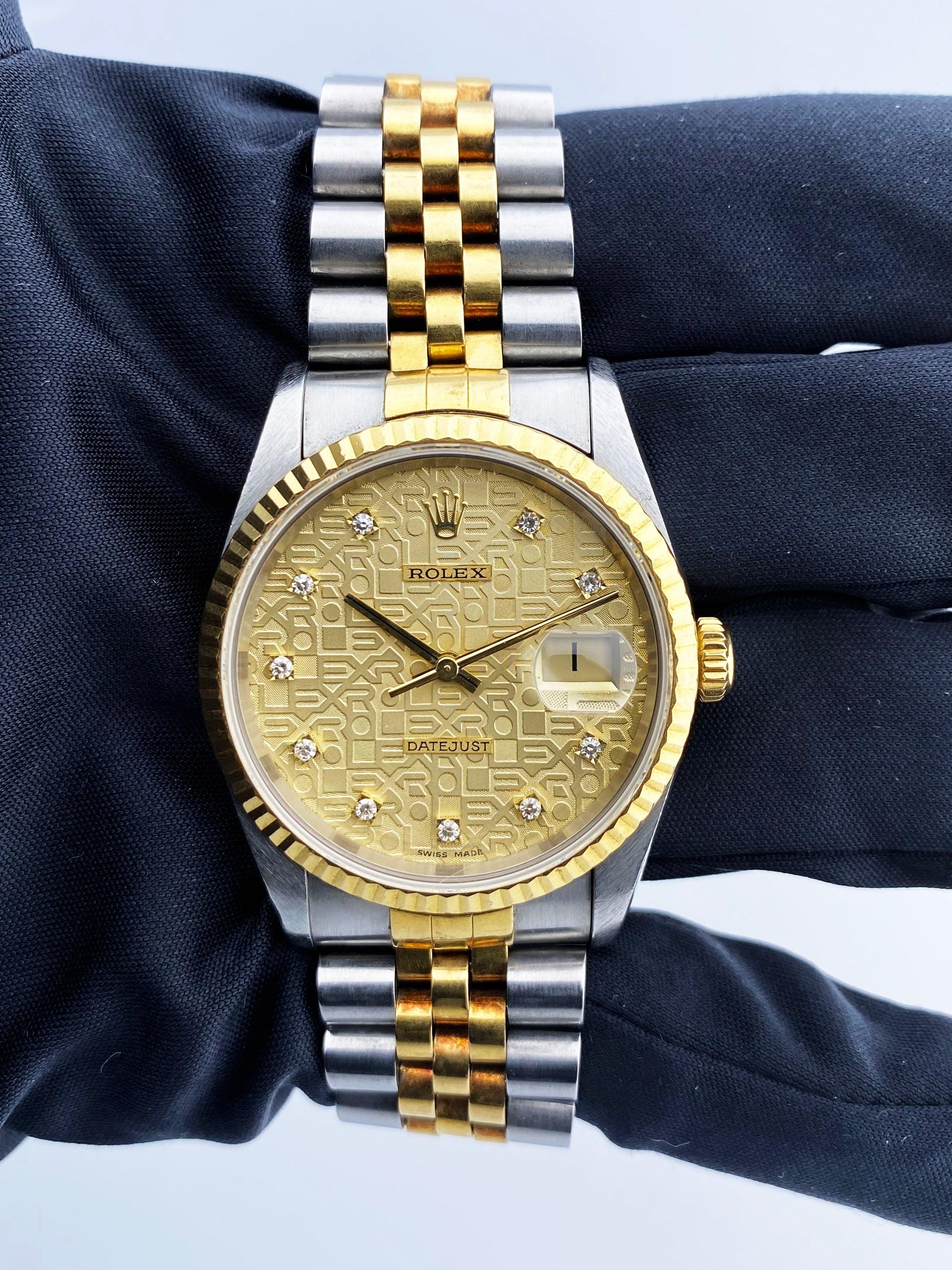 Rolex Datejust 16233 Mens Watch. 36mm stainless steel case. 18K yellow gold fluted bezel. Champagne Anniversary dial with gold hands and original factory diamond set hour markers. Date display at the 3 o'clock position. Stainless steel & 18k yellow