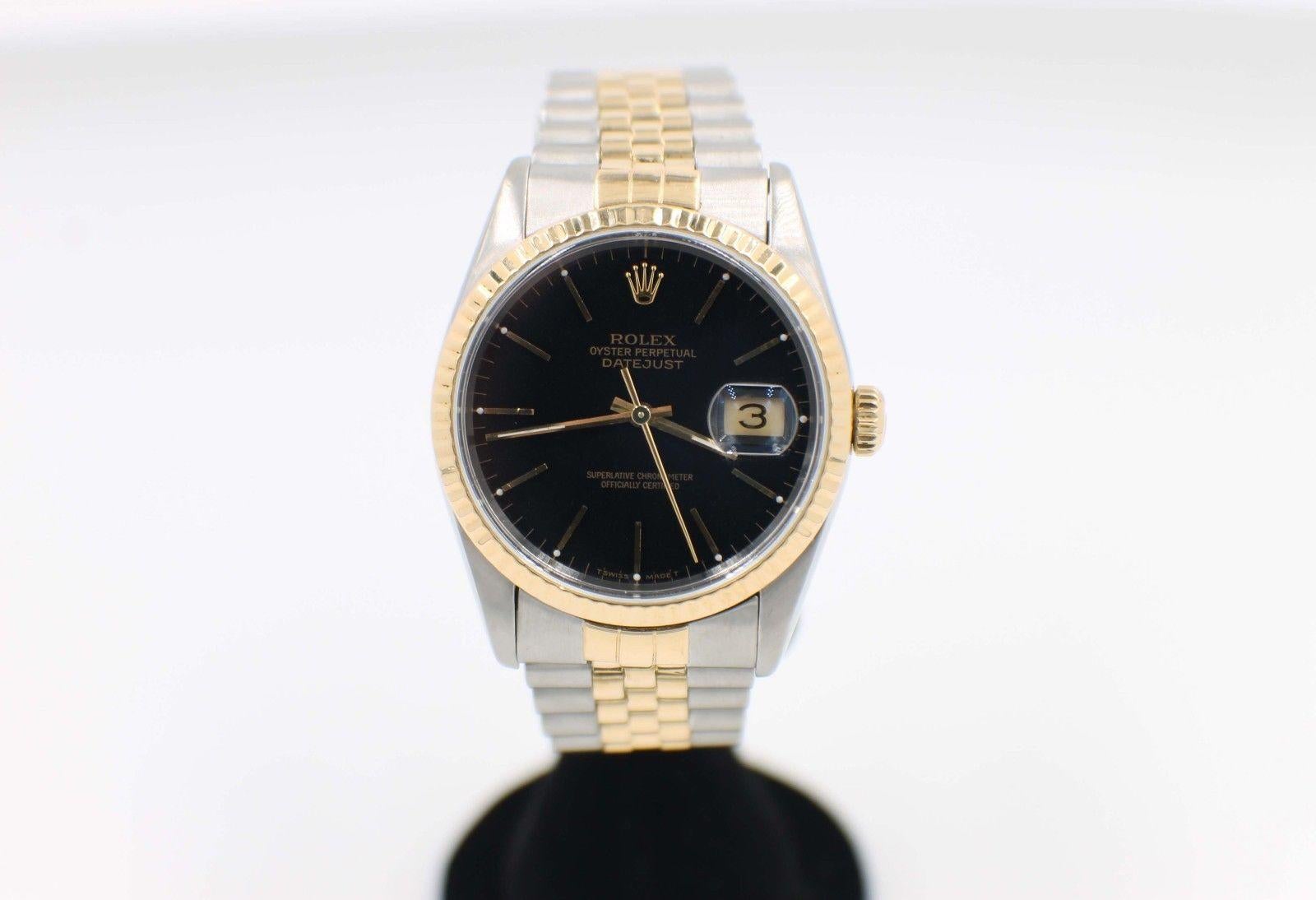 Style Number: 16233 
Serial: S523*** 
Model: Datejust 
Case Material: Stainless Steel 
Band: 18K Yellow Gold & Stainless Steel 
Bezel: 18K Yellow Gold 
Dial: Black 
Face: Sapphire Crystal  
Case Size: 36mm 
Includes: 
-Rolex Box & Papers
-Certified
