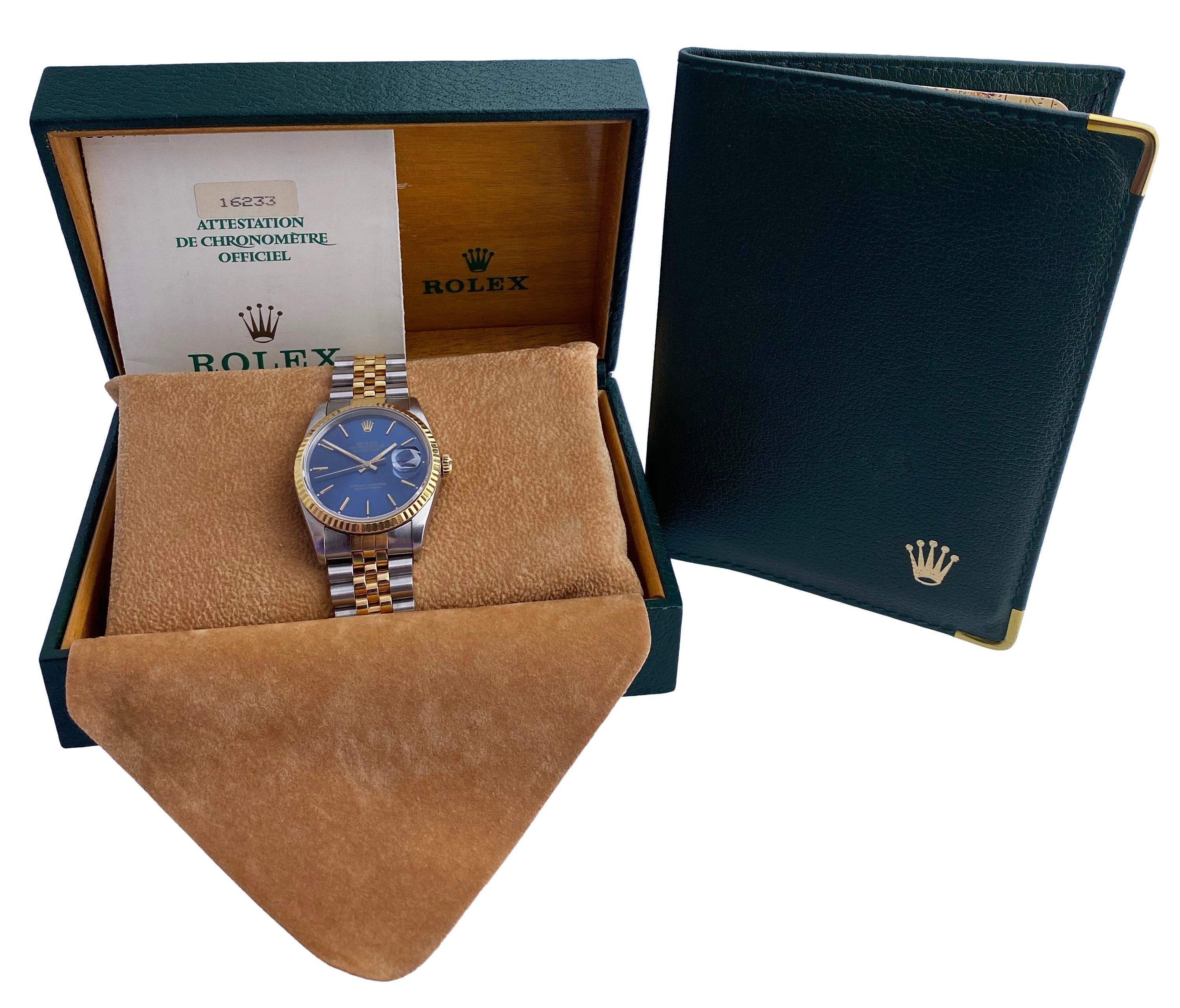 Rolex Oyster Perpetual Datejust 16233 Mens Watch. 36mm stainless steel case with 18K yellow gold fluted bezel. Blue dial with gold hands and gold index hour markers. Minute markers on the outer dial. Date display at the 3 o'clock position. Stainless