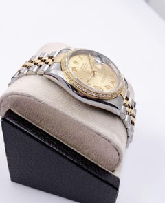 Rolex Datejust 16233 Diamond Bezel Champagne Dial 18 Karat Yellow Gold Stainless