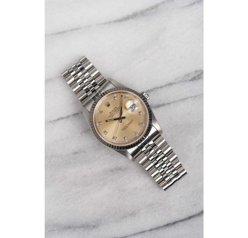 Here’s a vintage Rolex Datejust reference 16234 with a beautiful silver patina factory diamond dial from the 1990s. Keeps great time and is fully functional. Measurements of the case is 36mm and 20mm lug width. The dial developed an even cream color