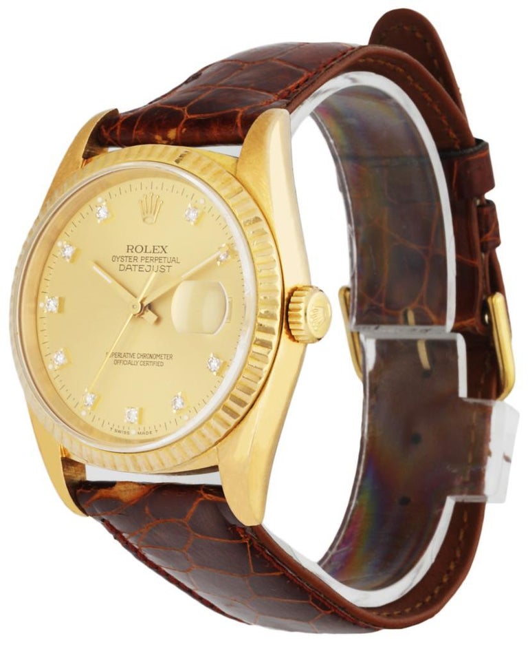 Rolex Datejust 16238 Men's Watch. 36mm 18k Yellow Gold case. 18K Yellow Gold fluted bezel. Champagne dial with gold hands and factory diamond hour markers. Minute markers on the outer dial. Date display at the 3 o'clock position. Brown Leather