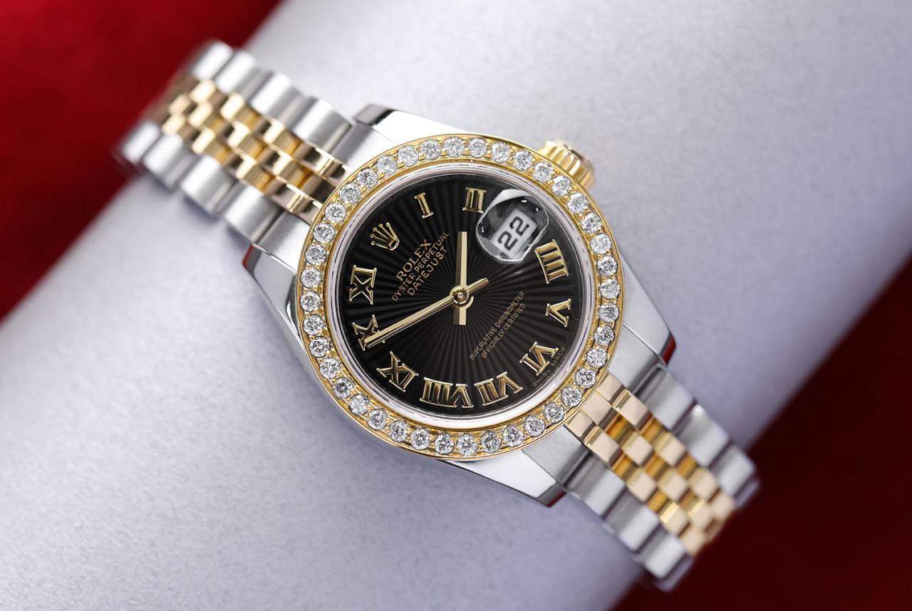 Rolex Lady-Datejust 179173 26mm Steel & Yellow Gold Watch Factory Black Sundust Dial

EXCELLENT CONDITION, TIGHT BAND. We are a premiere distributor of pre-owned and new watches, where we guarantee complete authenticity and corresponding aesthetic