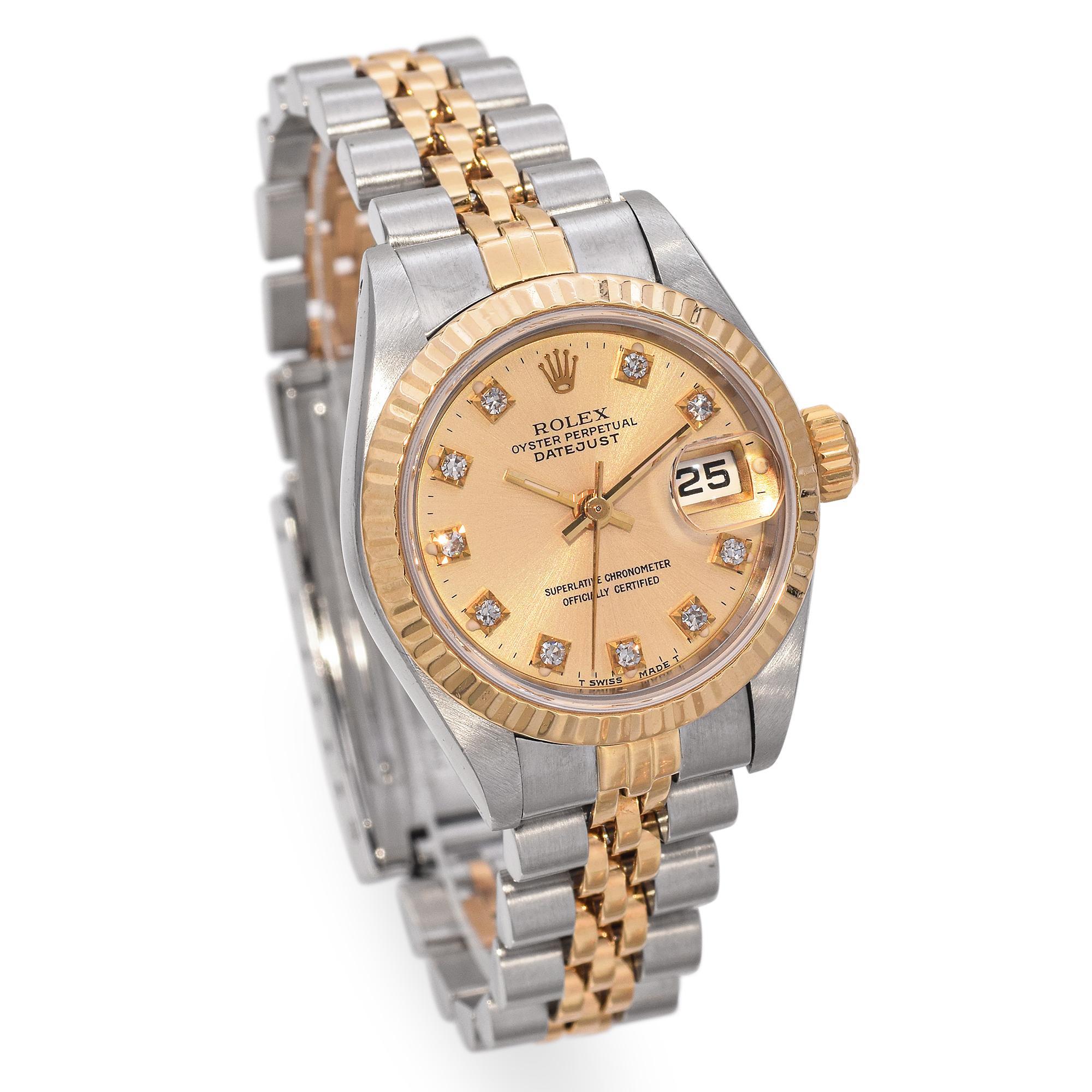 This elegant Rolex Oyster Perpetual Datejust (Ref. 69173) features a 26mm case crafted from a refined blend of 18k yellow gold and Oyster Steel. The watch showcases a striking fluted bezel and a white Roman numeral dial adorned with diamond hour