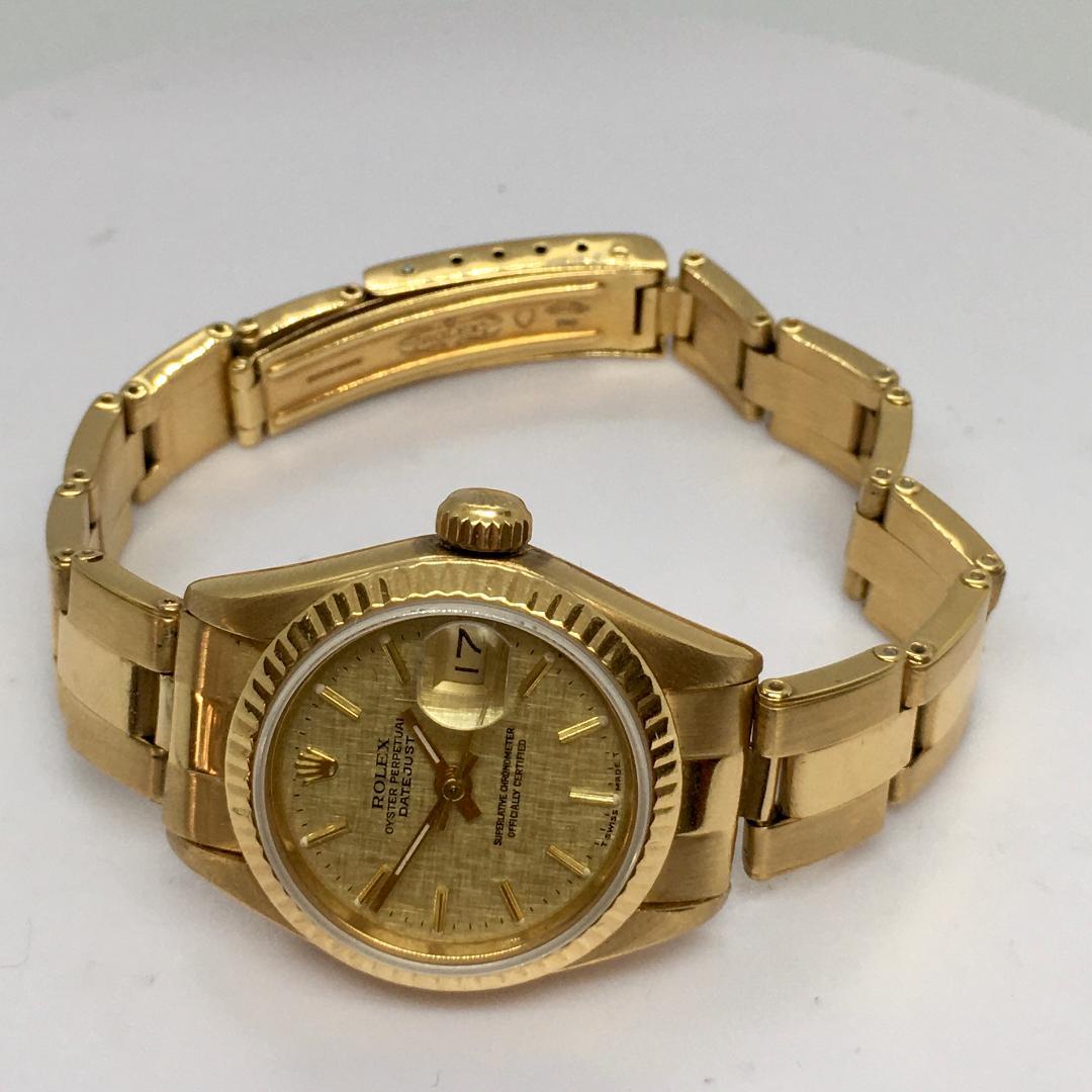 Rolex Datejust 18k Quickset Oyster Matte Champagne Automatic Ladies Watch 26mm

Measures 7 inch, bracelet including the case
Pre owned, engraved on back, evidence of repairs, all factory authentic, see pictures 
Ref 69000A , see back case
Original