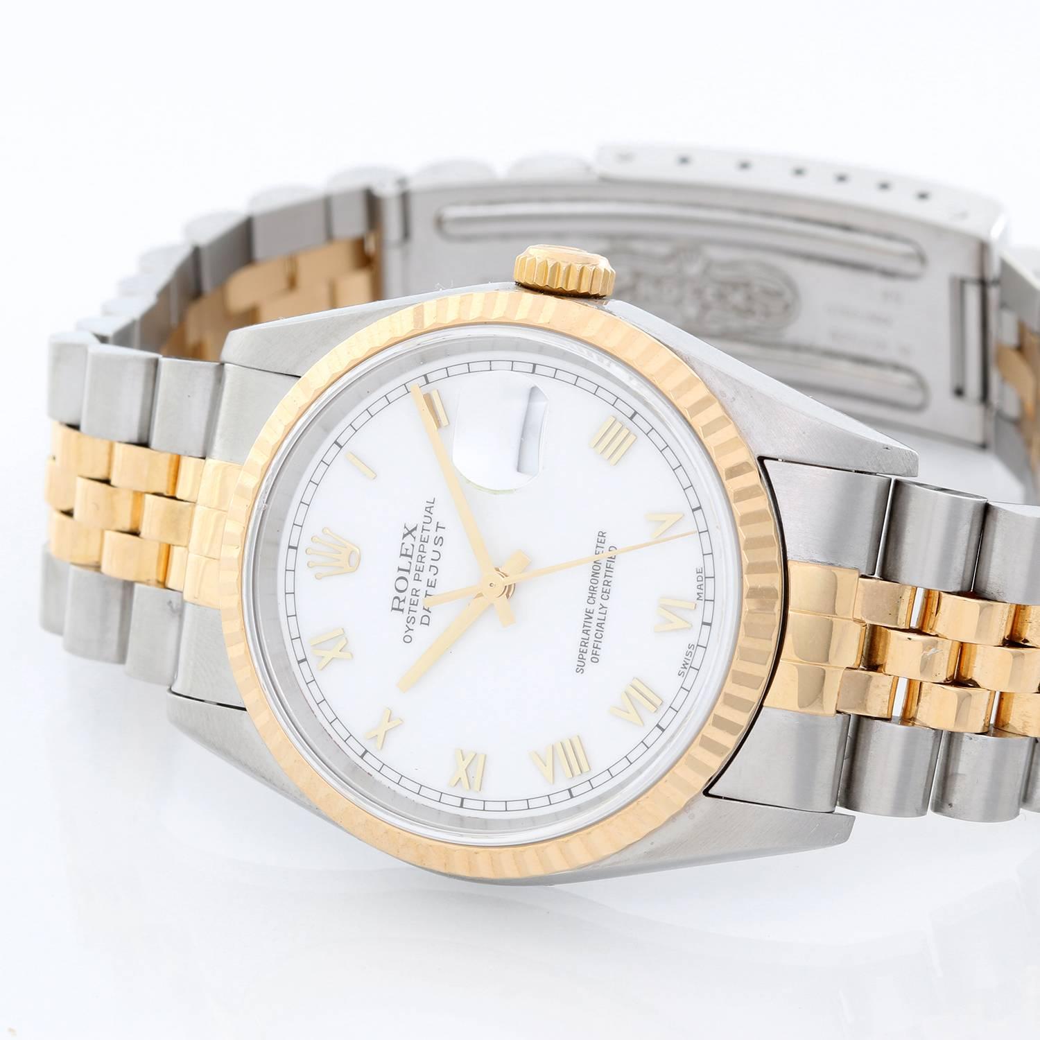 Rolex Datejust 2-Tone Men's Steel & Gold Watch 16233 -  Automatic winding, Quickset, sapphire crystal. Stainless steel case with 18k yellow gold fluted bezel (36mm diameter). White dial with gold Roman numerals. Stainless steel and 18k yellow gold