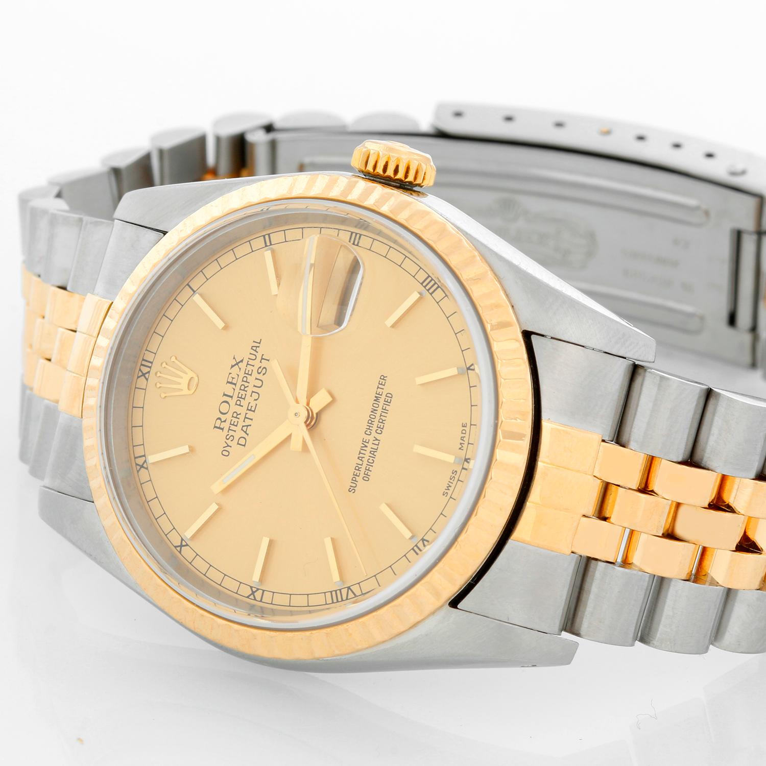 Rolex Datejust 2-Tone Men's Steel & Gold Watch 16233 - Automatic winding, Quickset, sapphire crystal. Stainless steel case with 18k yellow gold fluted bezel (36mm diameter). Champagne dial with stick hour markers. Stainless steel and 18k yellow gold