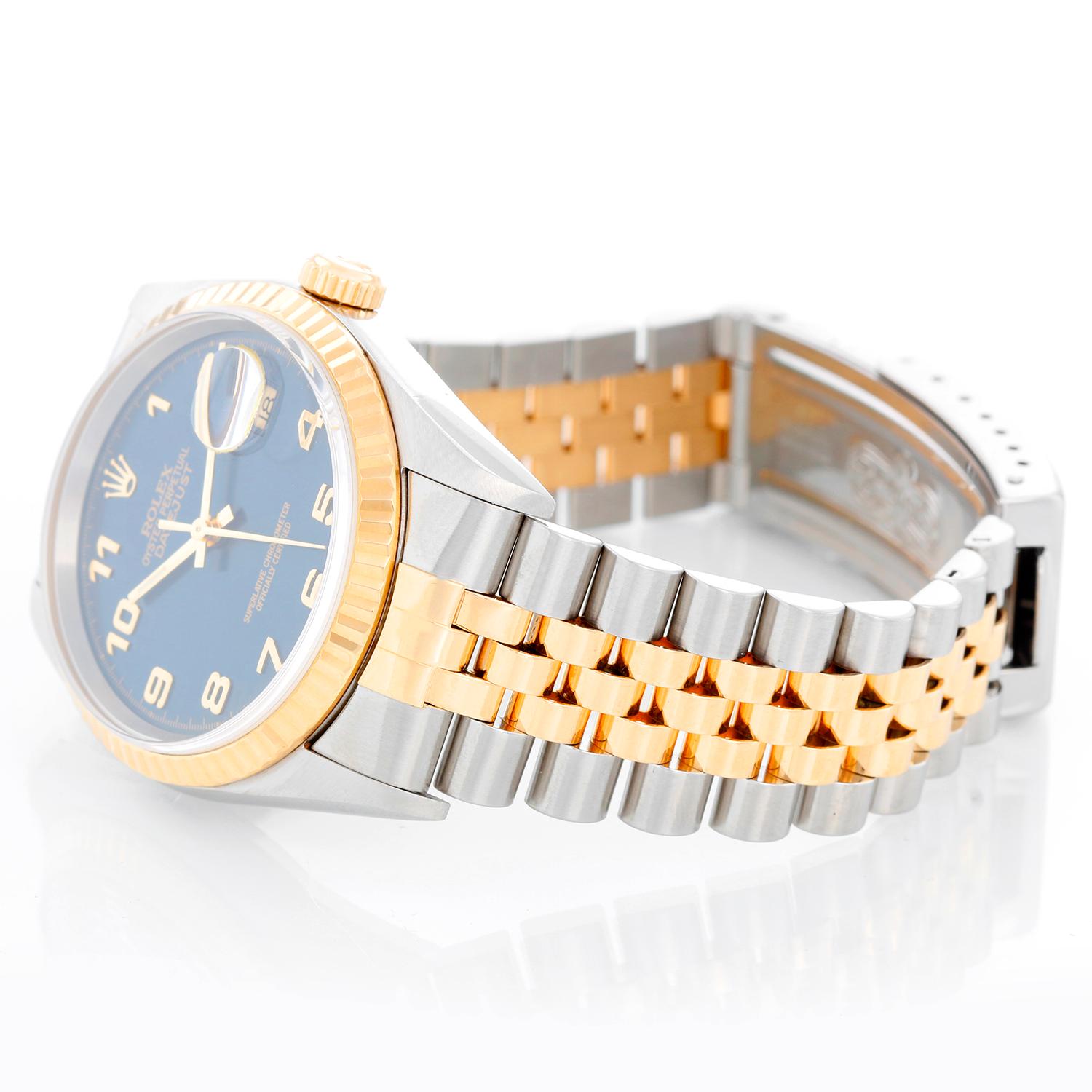 Rolex Datejust 2-Tone Men's Steel & Gold Watch 16233 - Automatic winding, Quickset, sapphire crystal. Stainless steel case with yellow gold bezel (36mm diameter). Blue dial with Arabic numerals . Stainless steel and 18k yellow gold Jubilee bracelet.