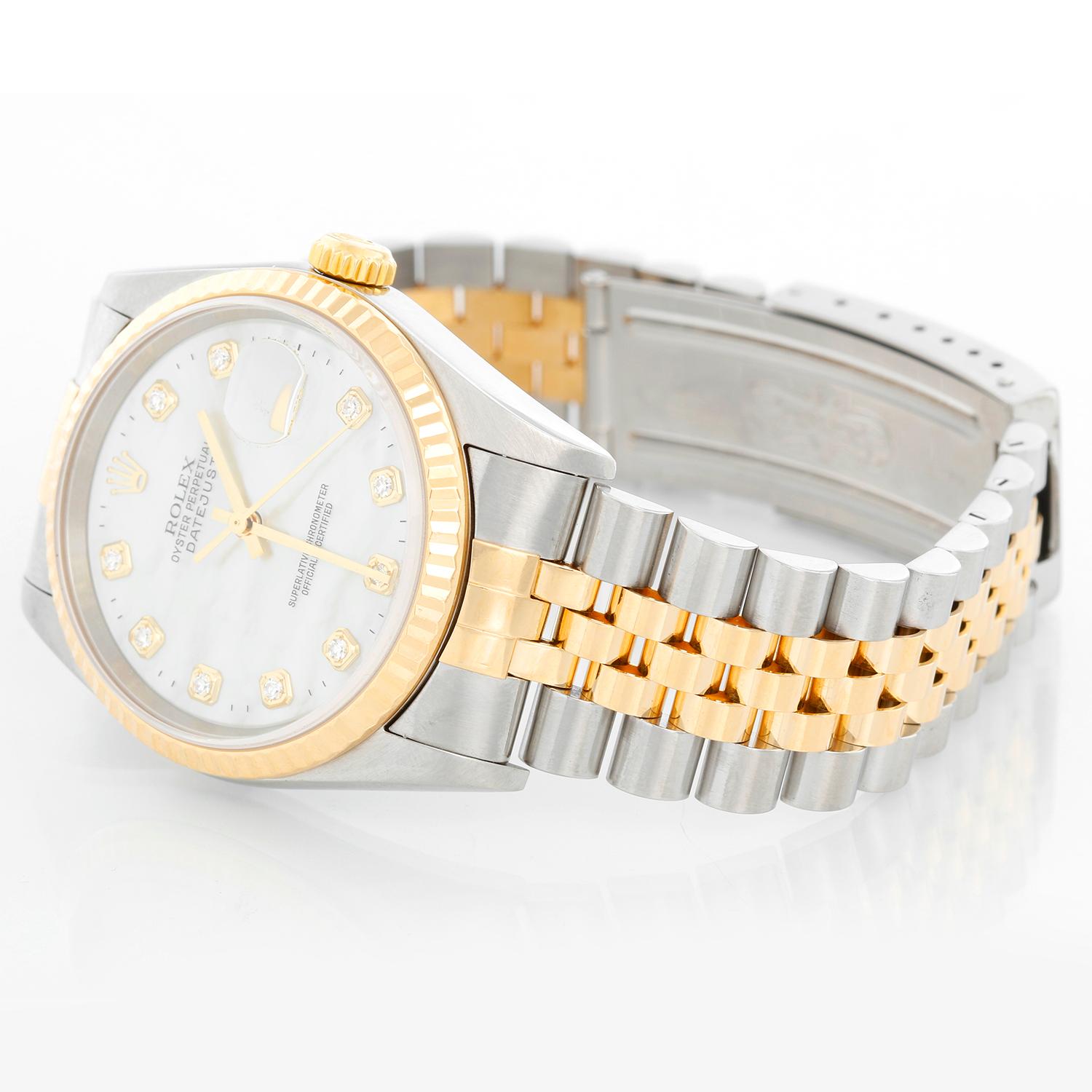 Rolex Datejust 2-Tone Men's Steel & Gold Watch 16233 - Automatic winding, Quickset, sapphire crystal. Stainless steel case with yellow gold bezel (36mm diameter). Factory Mother of Pearl Diamond dial. Stainless steel and 18k yellow gold Jubilee