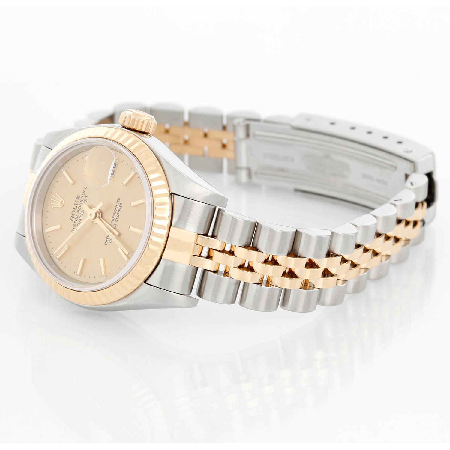 Rolex  Datejust 2-tone Steel & Gold Ladies Watch 79173 - Automatic winding, 29 jewels, Quickset date, sapphire crystal. Stainless steel case with 18k yellow gold fluted bezel (26mm diameter). Silver dial with stick hour markers. Stainless steel and