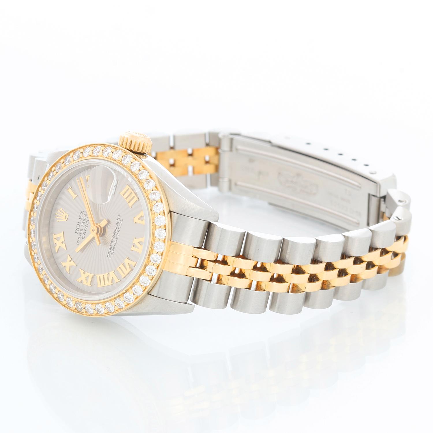 Rolex  Datejust 2-tone Steel & Gold Ladies Watch 79173 - Automatic winding, 29 jewels, Quickset date, sapphire crystal. Stainless steel case with custom diamond bezel  (26mm diameter). Gray Slate dial with Roman numerals . Stainless steel and 18k