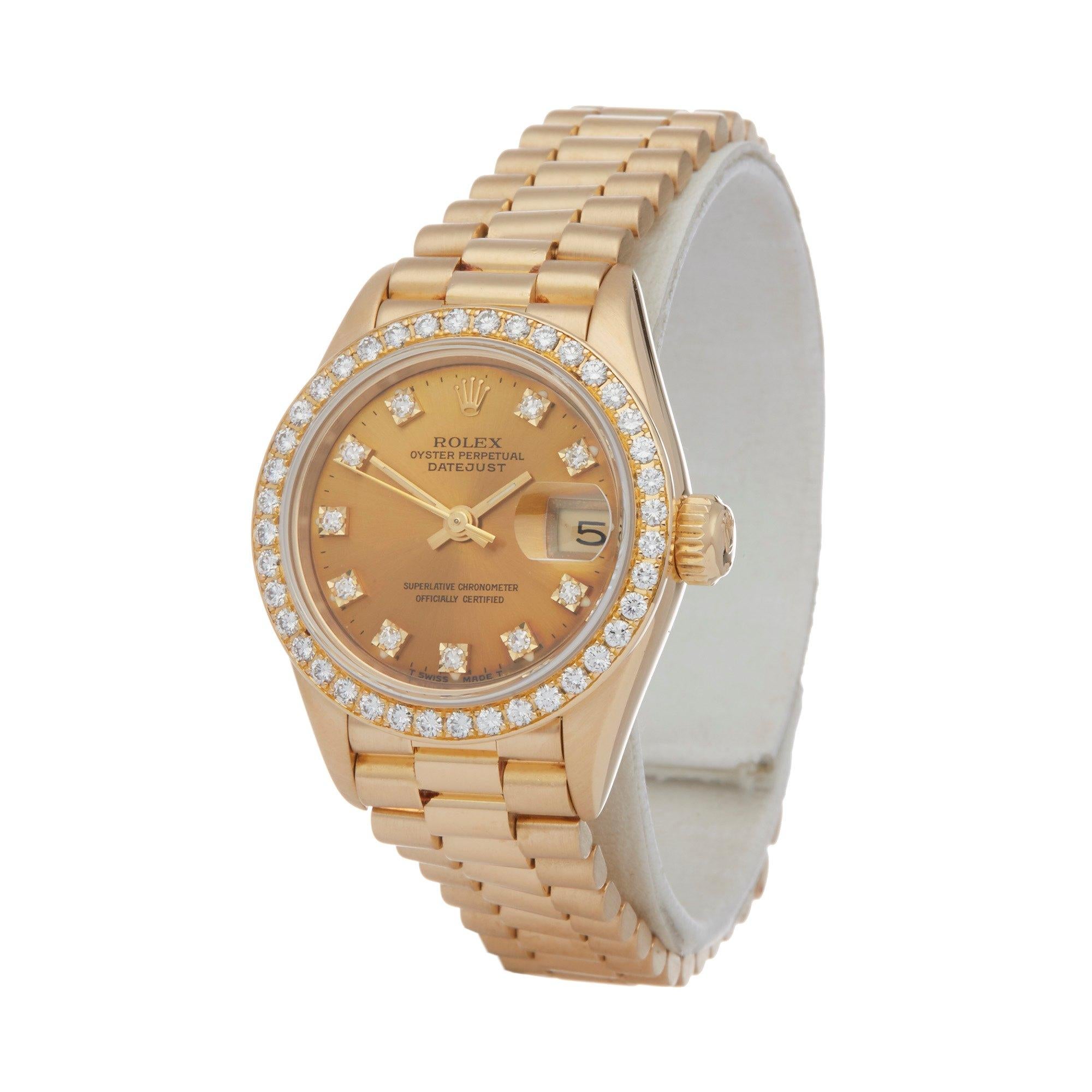 Xupes Reference: W007548
Manufacturer: Rolex
Model: Datejust
Model Variant: 26
Model Number: 69138
Age: 1990
Gender: Ladies
Complete With: Rolex Box
Dial: Champagne With Diamond Markers
Glass: Sapphire Crystal
Case Size: 26mm
Case Material: Yellow