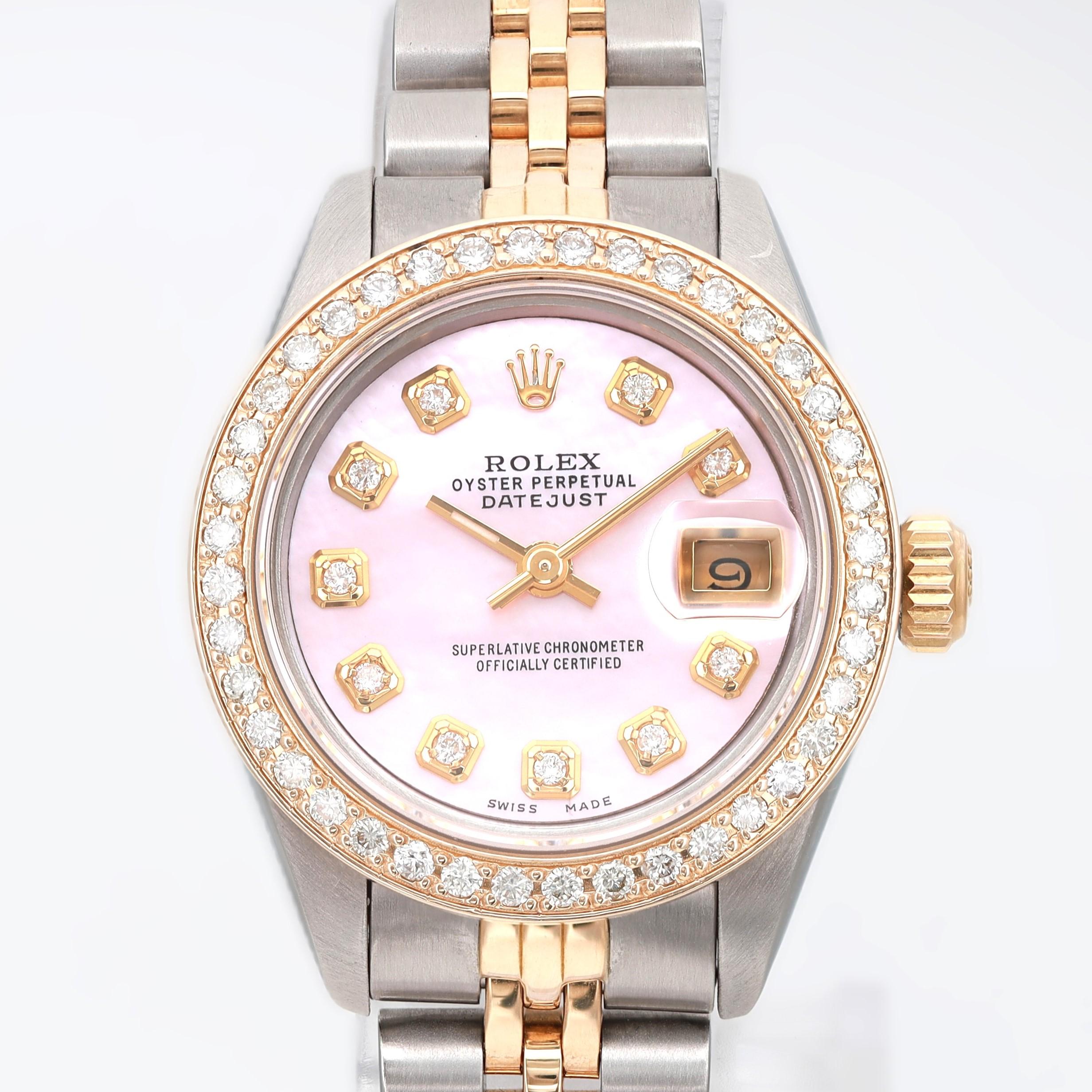 Pre-owned. Custom Dial and Diamond bezel.

eneral Information
Brand: Rolex
Model: Rolex Datejust 69173
Model Number: 69173
Type: Wristwatch
Style: Luxury
Department: Women
Year Manufactured: 1990-1999
Vintage: No
Country/Region of Manufacture: