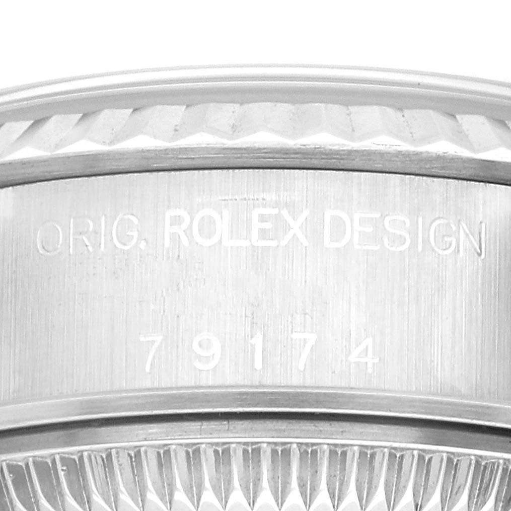 Rolex Datejust 26 Steel White Gold Black Dial Ladies Watch 79174 Box Papers. Officially certified chronometer self-winding movement. Stainless steel oyster case 26.0 mm in diameter. Rolex logo on a crown. 18k white gold fluted bezel. Scratch