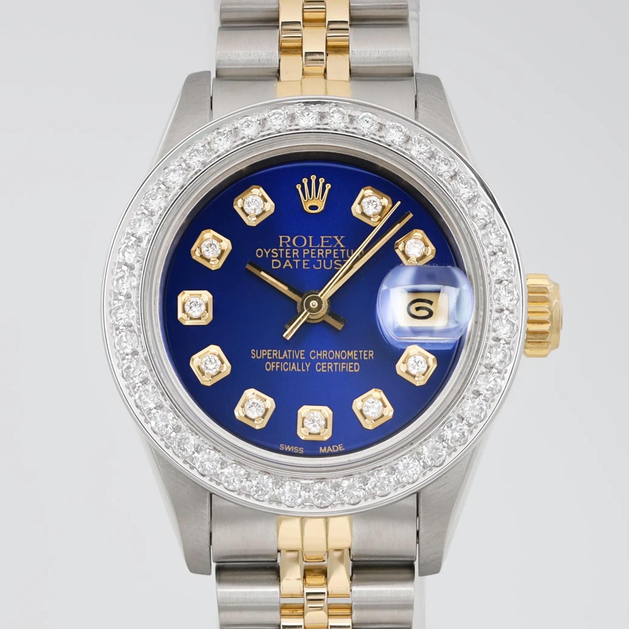 Pre-owned. Good condition. Custom diamond dial and bezel

General Information:
Brand: Rolex
Model: Rolex Datejust
Model Number: 69173
Type: Wristwatch
Department: Women
Style: Casual
Vintage: Yes
Country/Region of Manufacture: Switzerland

Movement
