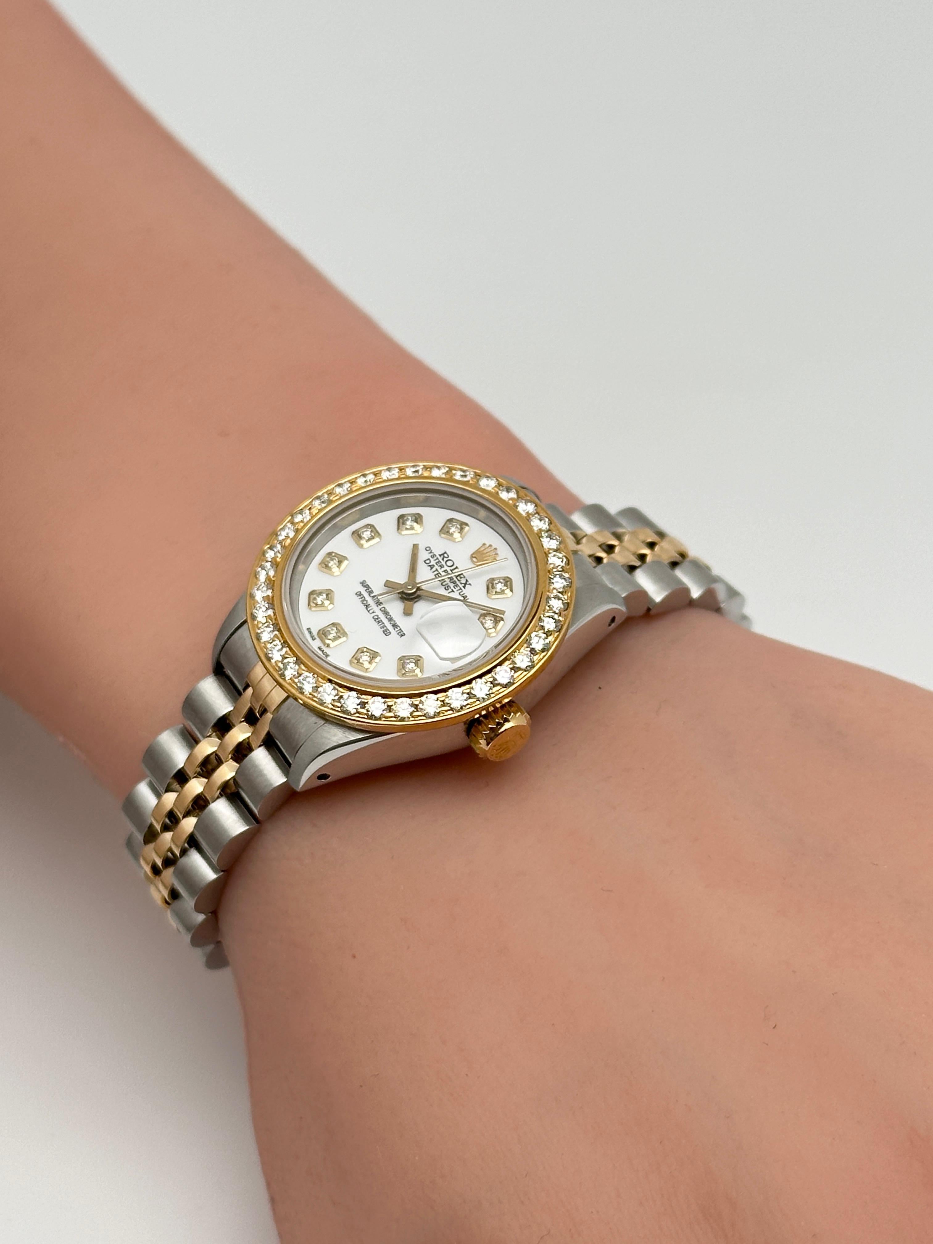 Pre-owned. Custom Diamond dial and bezel. Comes with the gift box.

General Information:
Brand: Rolex
Model: Rolex Datejust
Model Number: 69173
Type: Wristwatch
Department: Women
Style: Casual
Vintage: Yes
Country/Region of Manufacture: