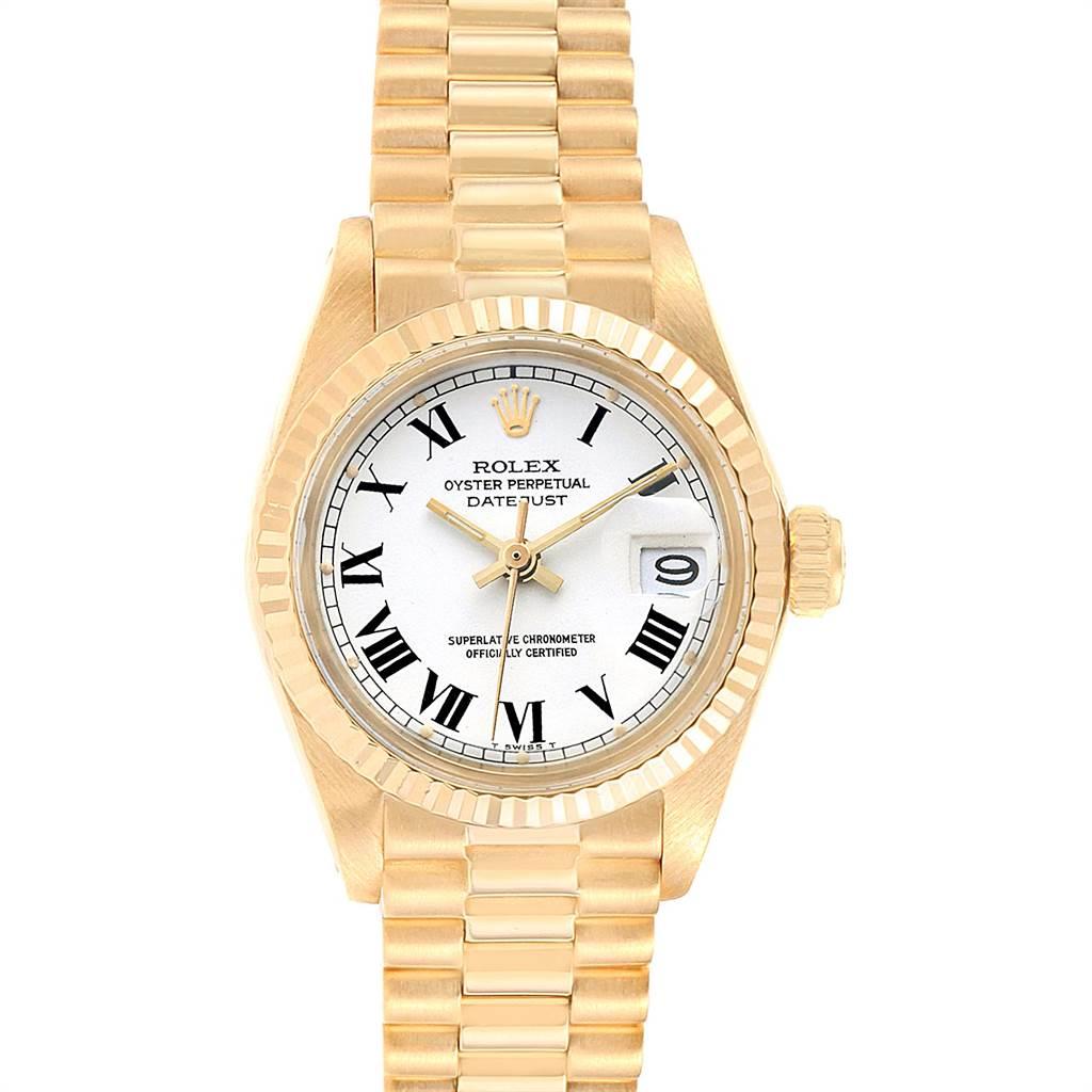 Rolex Datejust 26mm 18K Yellow Gold White Dial Ladies Watch 6917. Automatic self-winding movement. 18K yellow gold oyster case 24.0 mm in diameter. Rolex logo on crown. 18k yellow gold fluted bezel. Acrilic crystal. White dial with roman numerals.