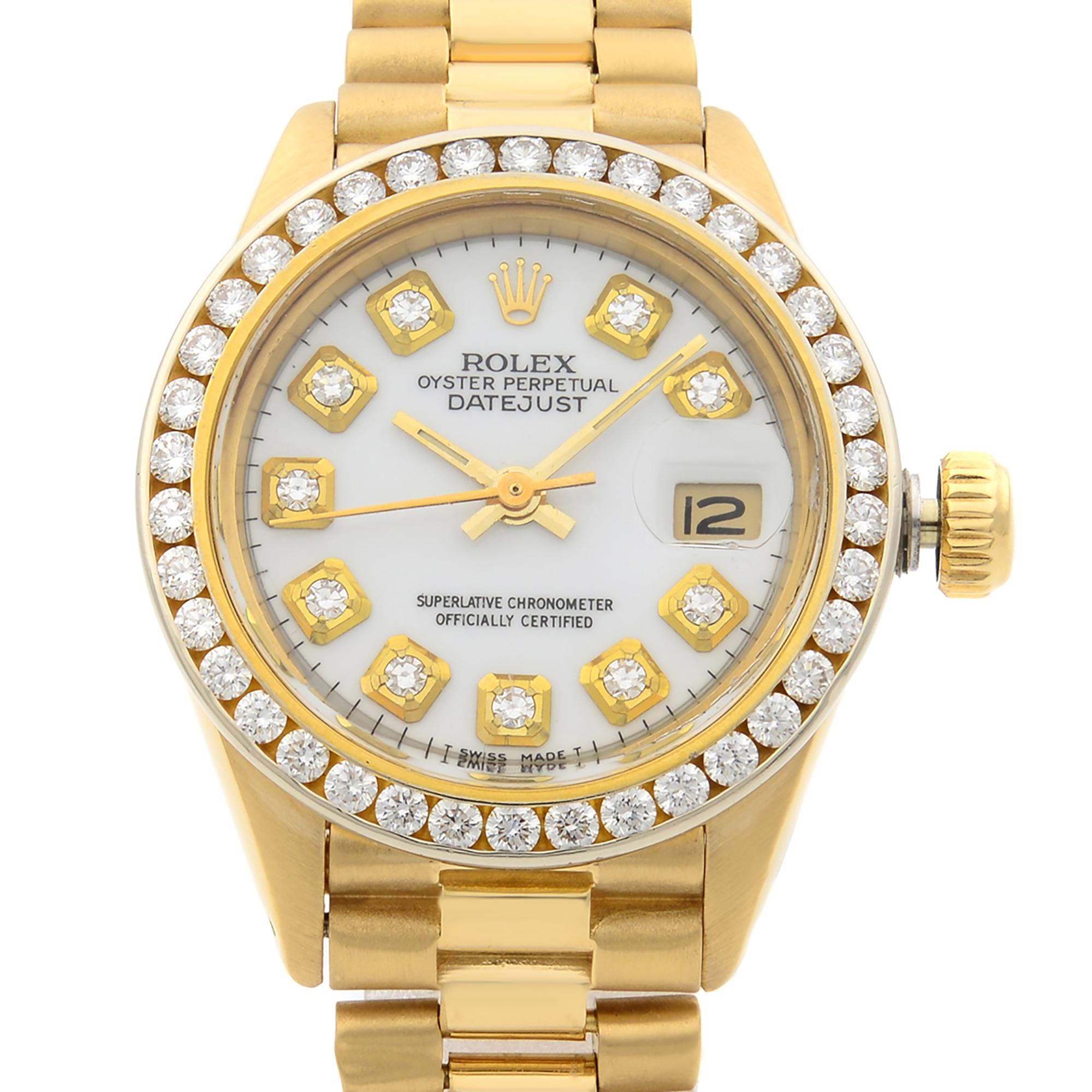 This pre-owned Rolex Datejust  6917 is a beautiful Ladie's timepiece that is powered by mechanical (automatic) movement which is cased in a yellow gold case. It has a round shape face, date indicator, diamonds dial and has hand diamonds style