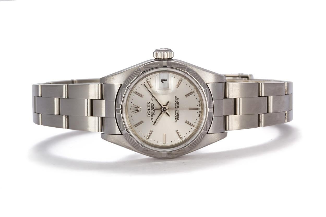 We are pleased to offer this 2002 Stainless Steel 26mm Ladies Rolex Datejust 79190. It features a 26mm stainless steel case, engine turned bezel, silver stick dial, stainless steel oyster bracelet and Rolex automatic movement. It will fit up to a 7