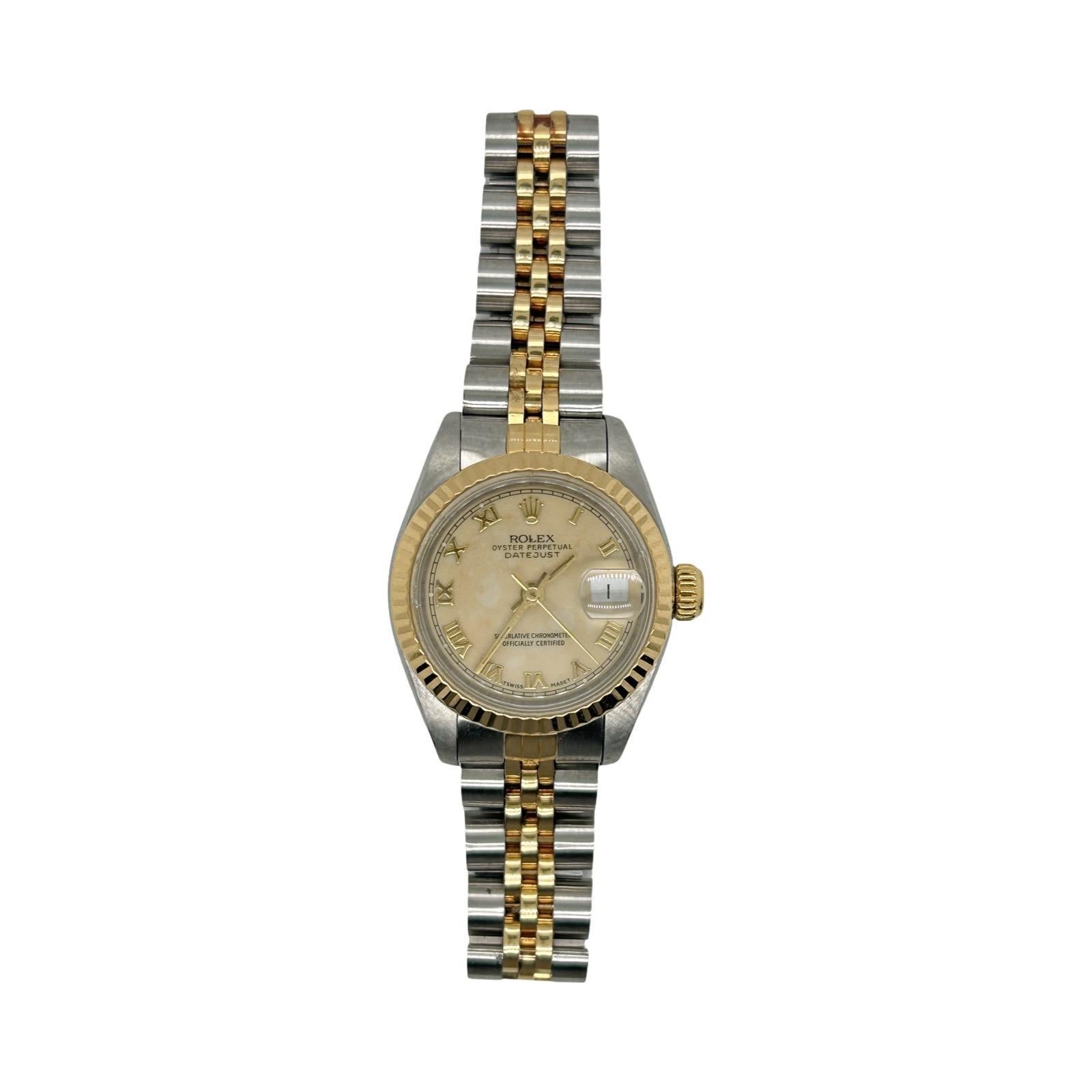Brand: Rolex
Metal: Stainless Steel/Yellow Gold
Condition: Pre-Owned
Reference Number: 69173
Year: 1991
Model: Datejust 
Movement: Automatic Movement
Case Diameter/Width: 26mm
Crystal: Scratch Resistant Sapphire
Bezel: Fluted
Dial: Champagne Roman
