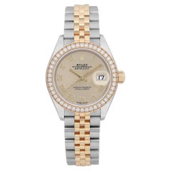 Rolex Montre Datejust 28mm en acier et or avec lunette en diamants et cadran champagne pour femmes 279383