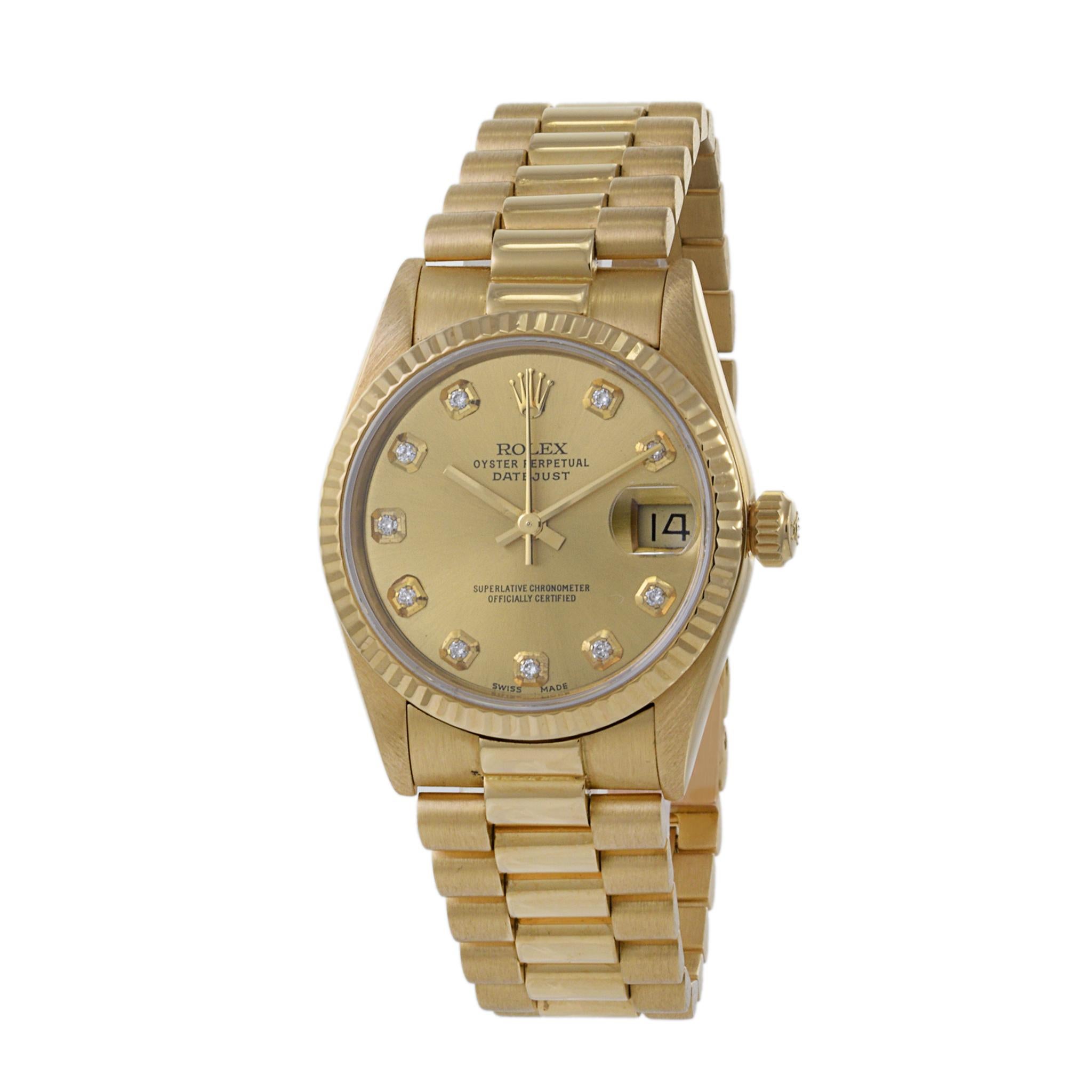 Dies ist ein großer Zustand 1986 Rolex 31mm Datejust Referenz 68278 in 18K Gelbgold. Diese Uhr ist ein Modell mit Schnellverstellung des Datums.

Das Zifferblatt hat werkseitig gesetzte Diamantmarker. Das Originalarmband ist im Präsidentschaftsstil