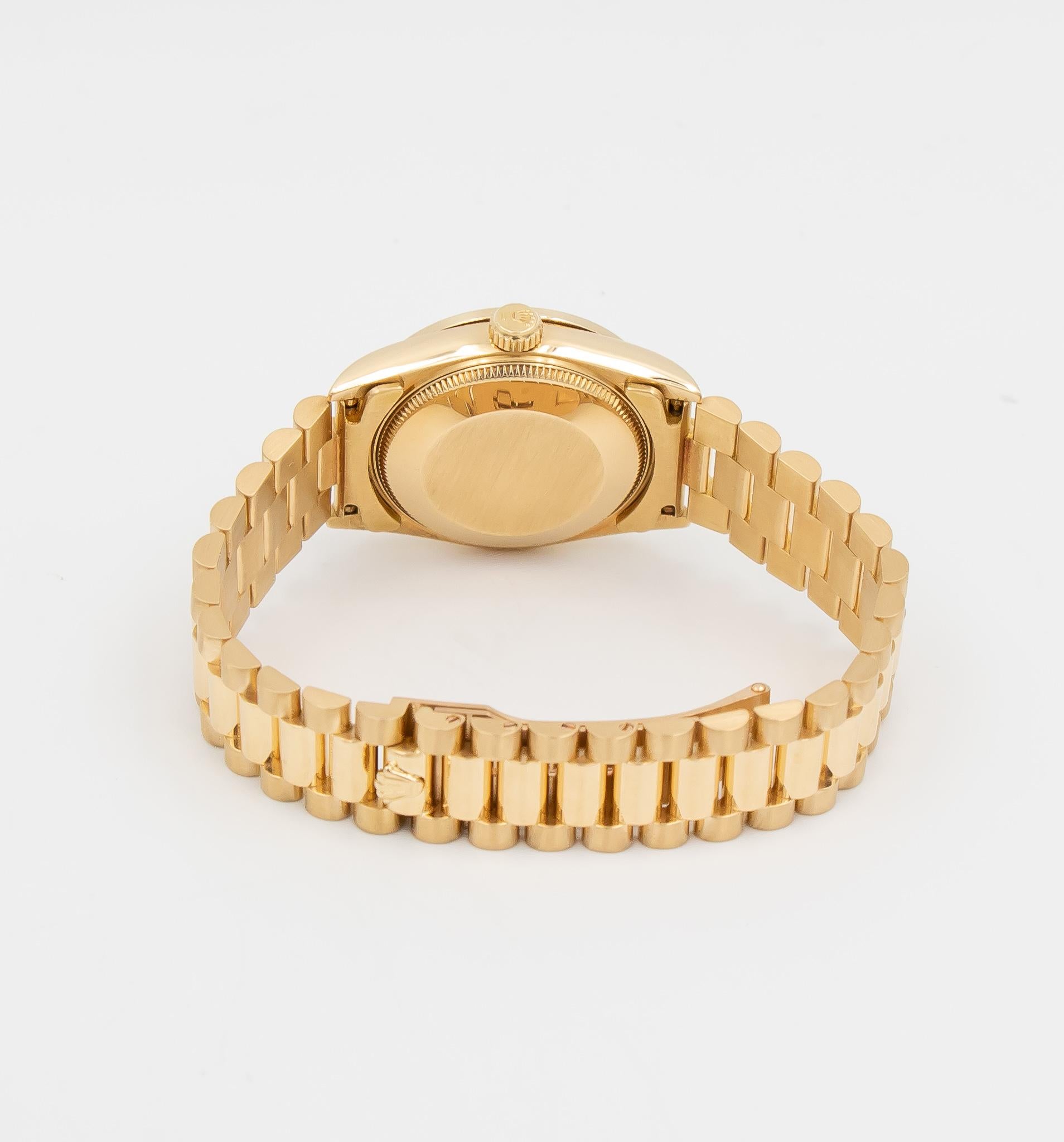 This beautiful ladies Rolex watch was recently serviced and runs great!  This DateJust 31 features an 18k yellow gold case & bracelet, a custom diamond bezel, and a stunning mother-of-pearl dial with diamond markers. Powering this watch is Rolex's