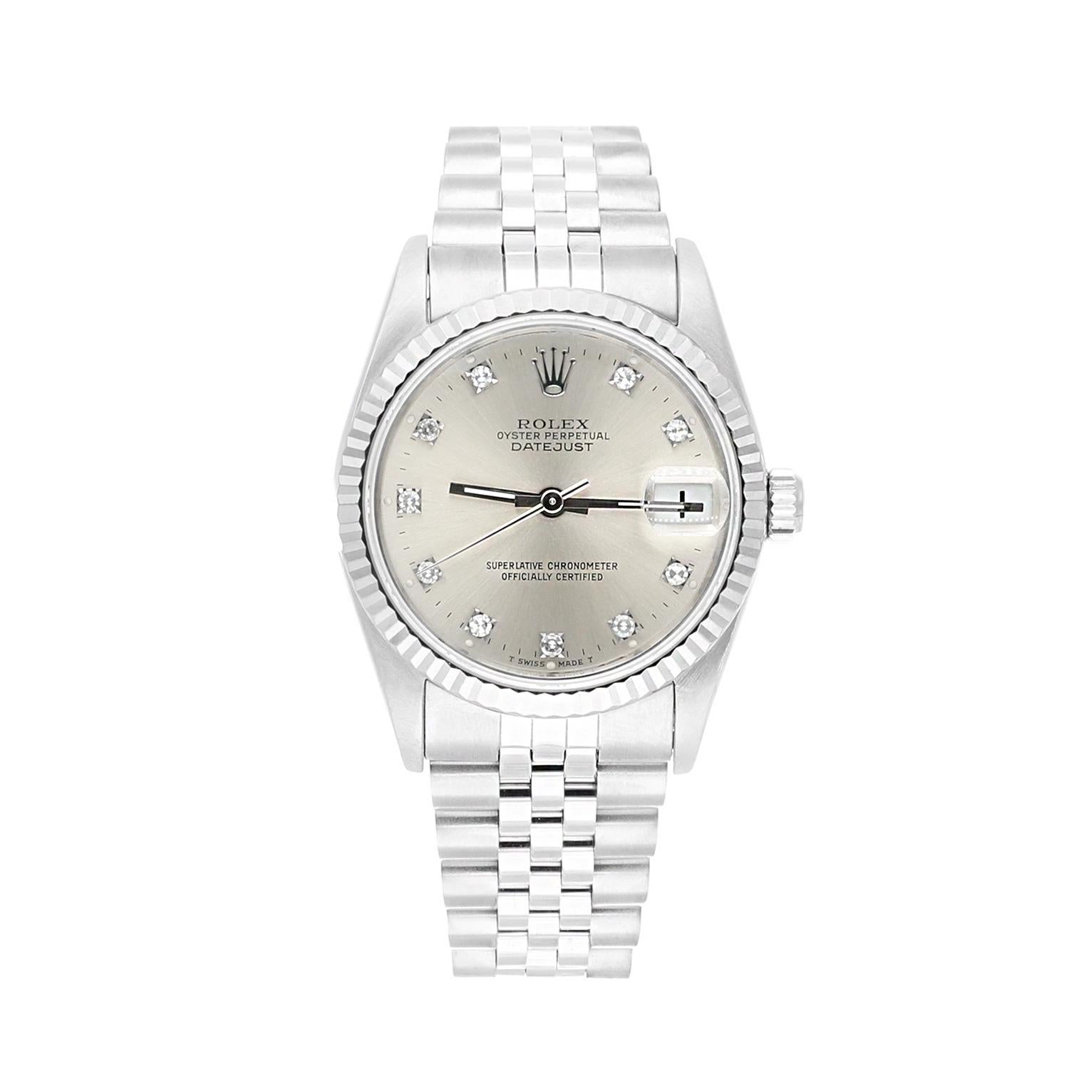 Rolex Datejust 31mm Silver Diamond Dial Stainless Steel Watch White Gold Bezel, N Serial.
Cette montre a été professionnellement polie, révisée et est en excellent état général. Il n'y a absolument aucune rayure ou imperfection visible. Authenticité
