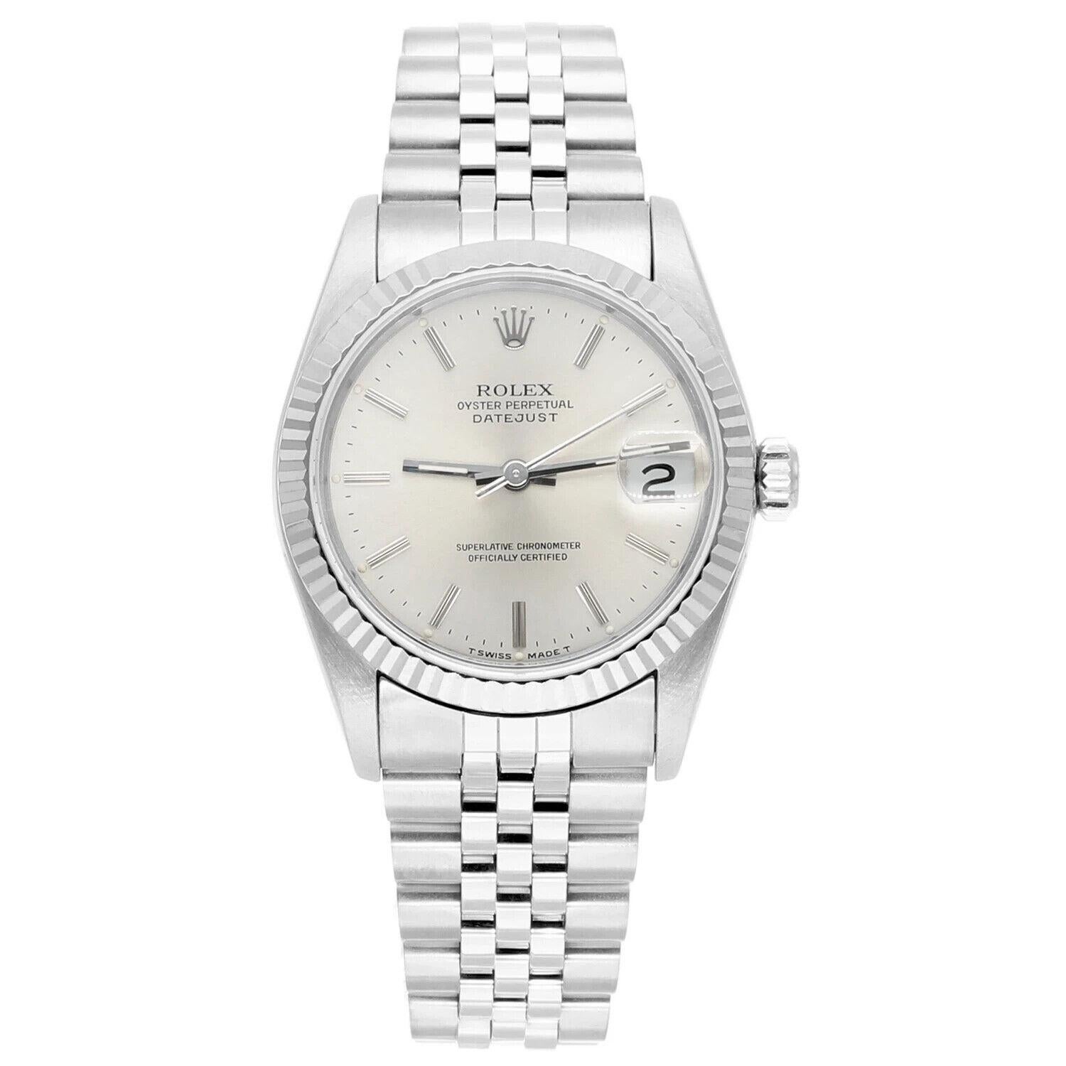 Silver-tone stainless steel case with a silver-tone stainless steel jubilee bracelet. Fixed 18kt white gold bezel. Silver-tone dial with silver-tone hands and index hour markers. Minute markers around the outer rim. Dial Type: Analog. Date display