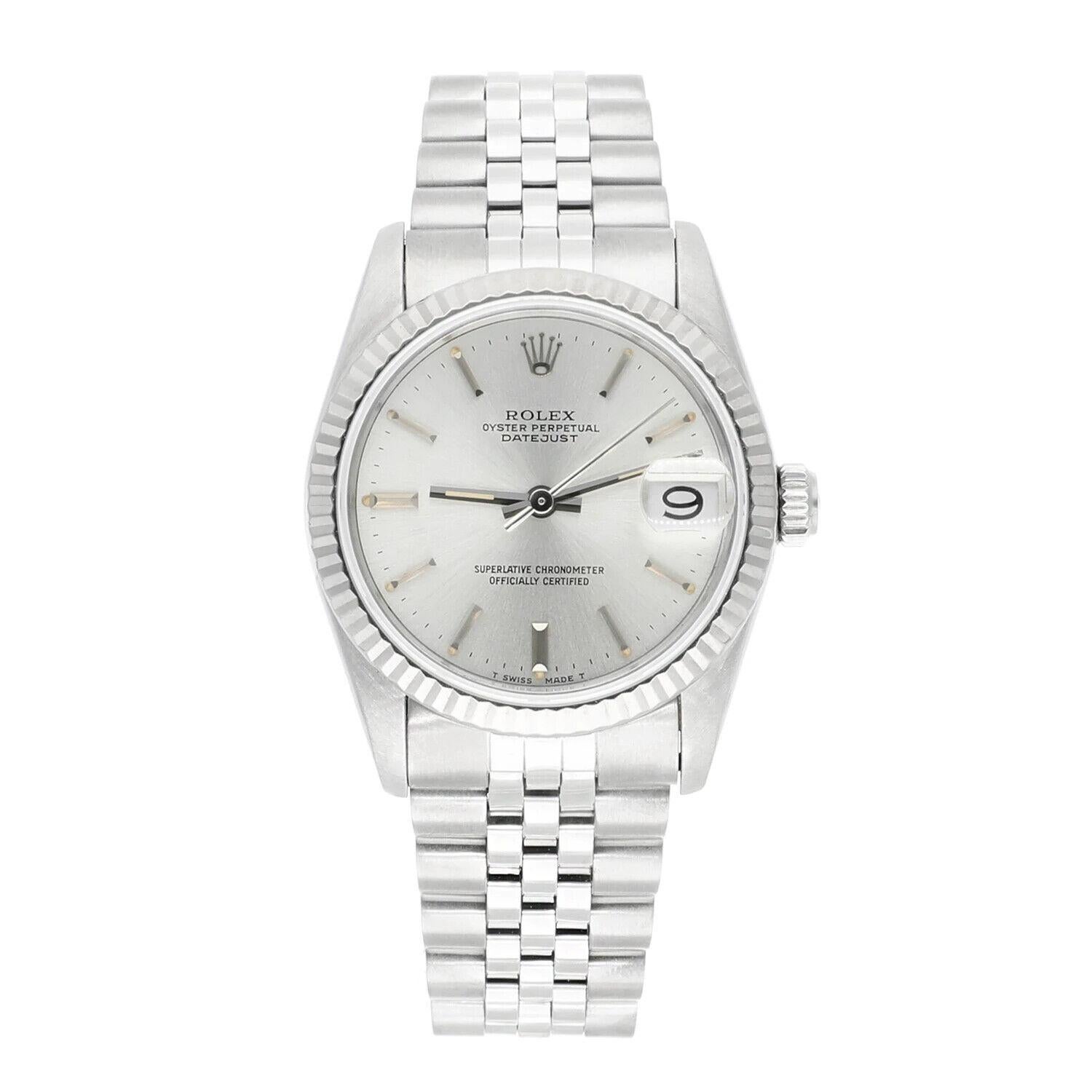 Rolex Datejust 31mm Silver Stick Dial Stainless Steel Watch White Gold Bezel, Circa 1984.
This watch has been professionally polished, serviced and is in excellent overall condition. There are absolutely no visible scratches or blemishes.