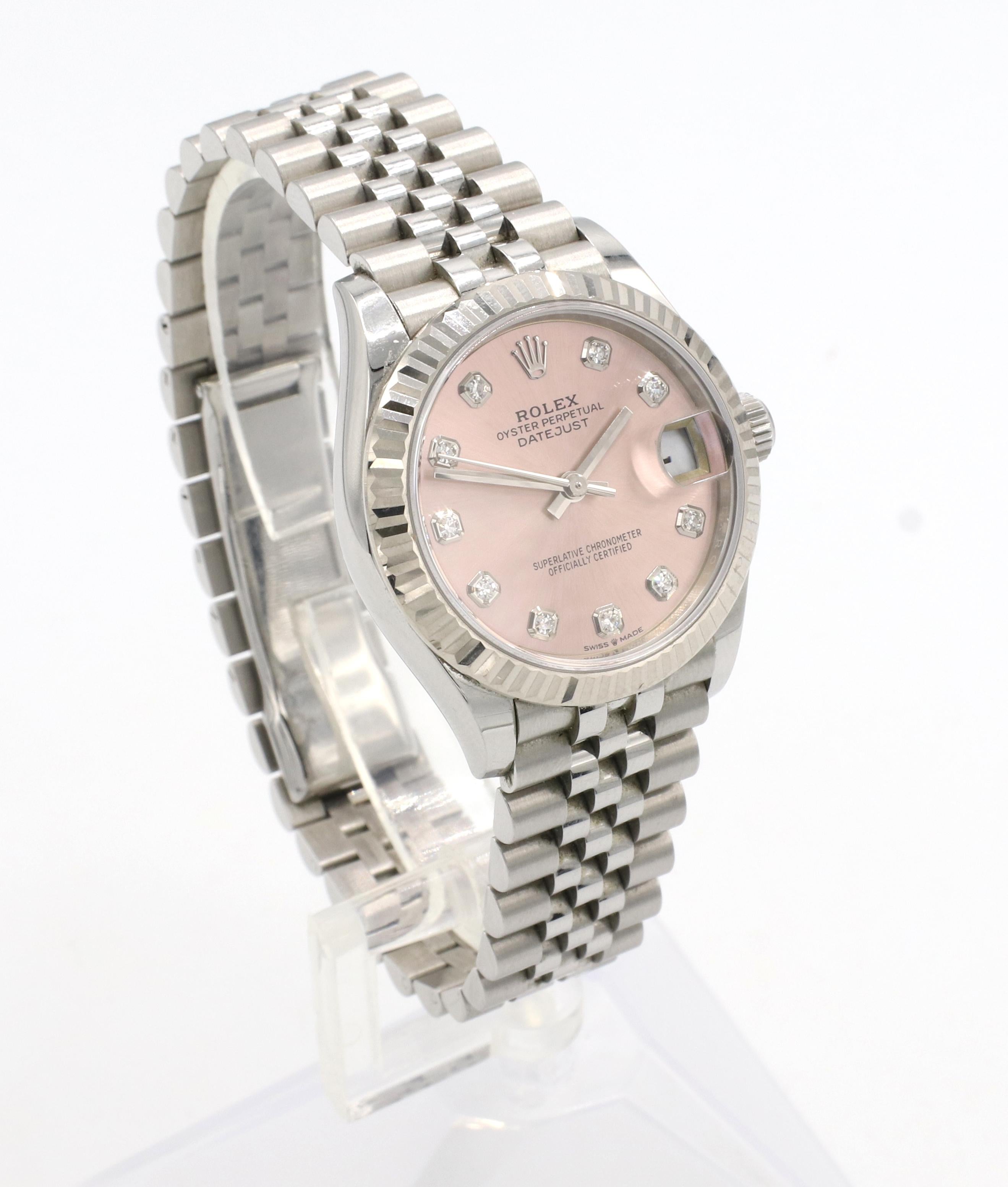 Rolex Datejust 31 Stainless Steel Pink Natural Diamond Dial Ladies Watch Reference 278274
Model: 278274
Serial: 561***** (card dated 2021)
Metal: Stainless steel
Movement: Automatic
Case: 31mm
Bezel: Polished 18k white gold fluted bezel
Dial: Pink,
