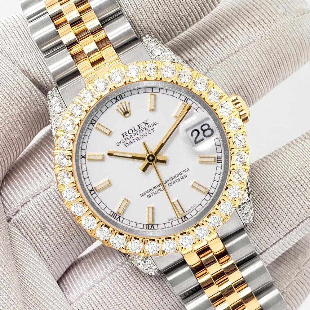 ElegantSwiss a le plaisir de vous proposer cette montre Rolex Datejust midsize 31mm 2-Tone white index with 4.4ct diamond bezel/case (diamonds are not set by Rolex) yellow gold and stainless steel jubilee watch, Ref 178273.

Excellent état,
