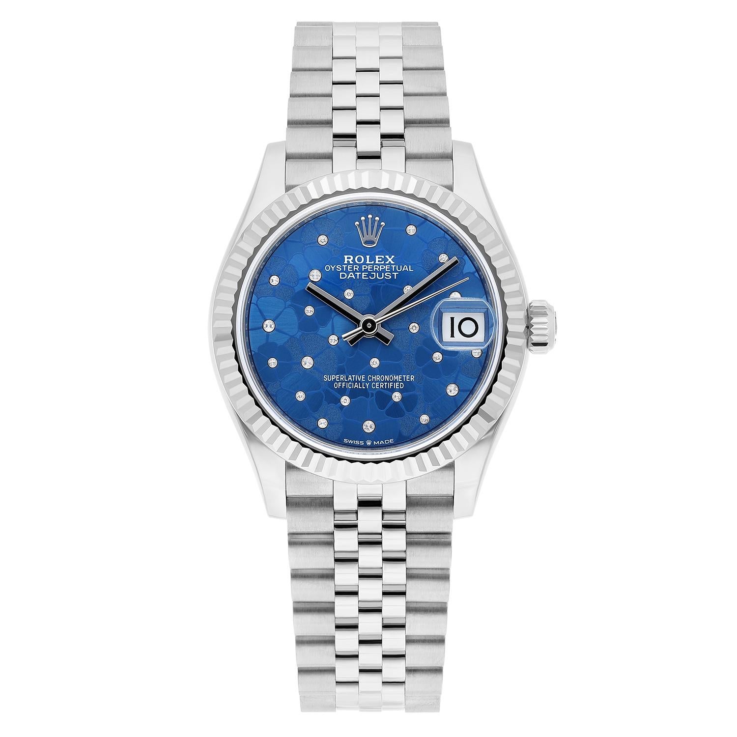 This Rolex Datejust watch for women is a stunning luxury timepiece with a 31mm stainless steel case and a beautiful blue floral-motif diamond dial. It is a versatile watch for both casual and formal occasions. This unworn Rolex Datejust comes with a
