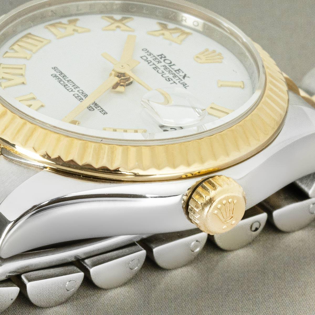 A 31mm stainless steel and yellow gold Datejust by Rolex. Featuring a white dial with Roman numerals and a yellow gold fluted bezel. Fitted with sapphire crystal and a self-winding automatic movement. The watch is presented on a Jubilee bracelet