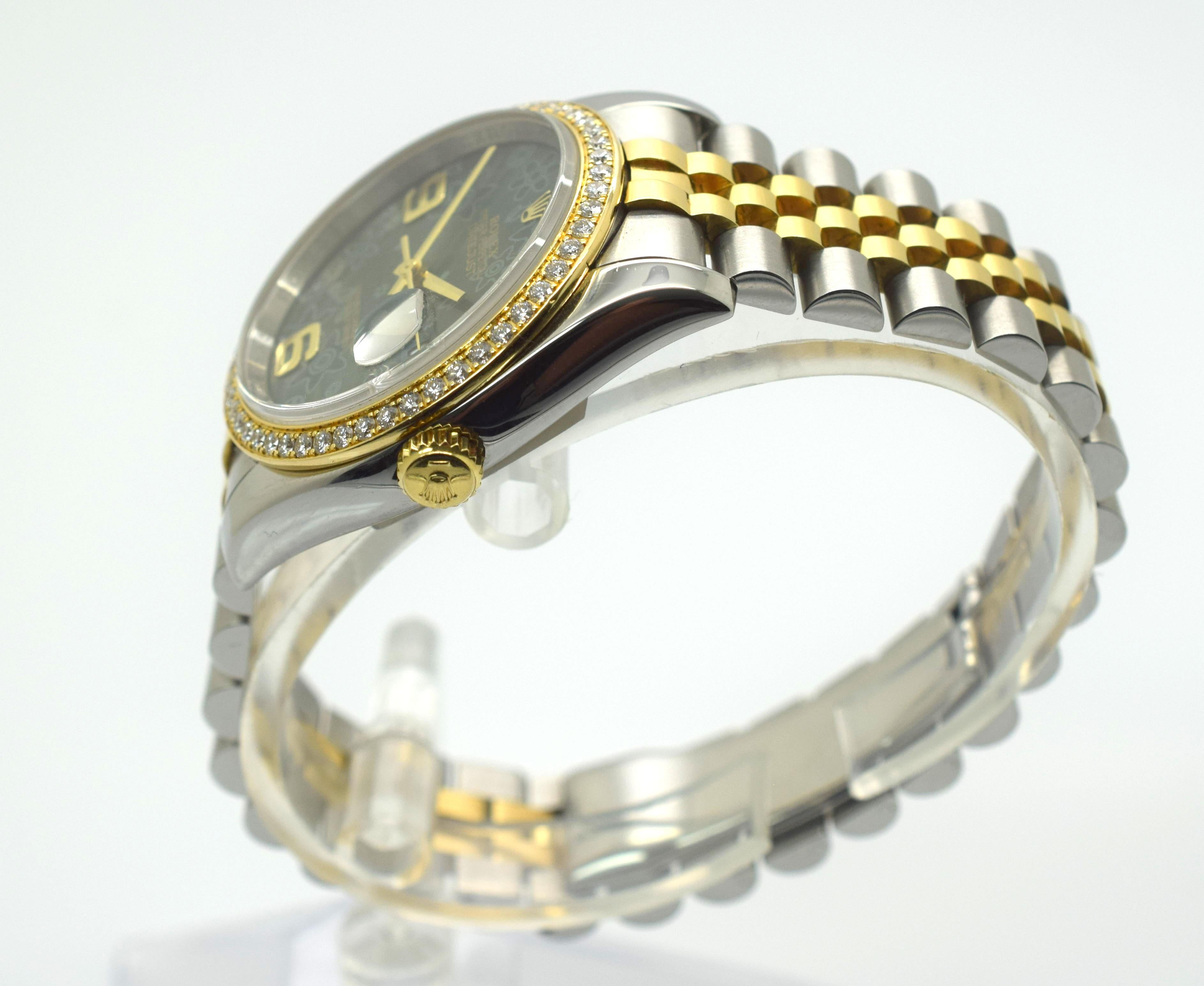 Stainless steel and 18kt yellow gold case with a stainless steel and 18kt yellow gold jubilee bracelet. Fixed 18kt yellow gold bezel set with 52 diamonds bezel. Green floral dial with gold-tone hands and Arabic hour markers. Dial Type: Analog. Date