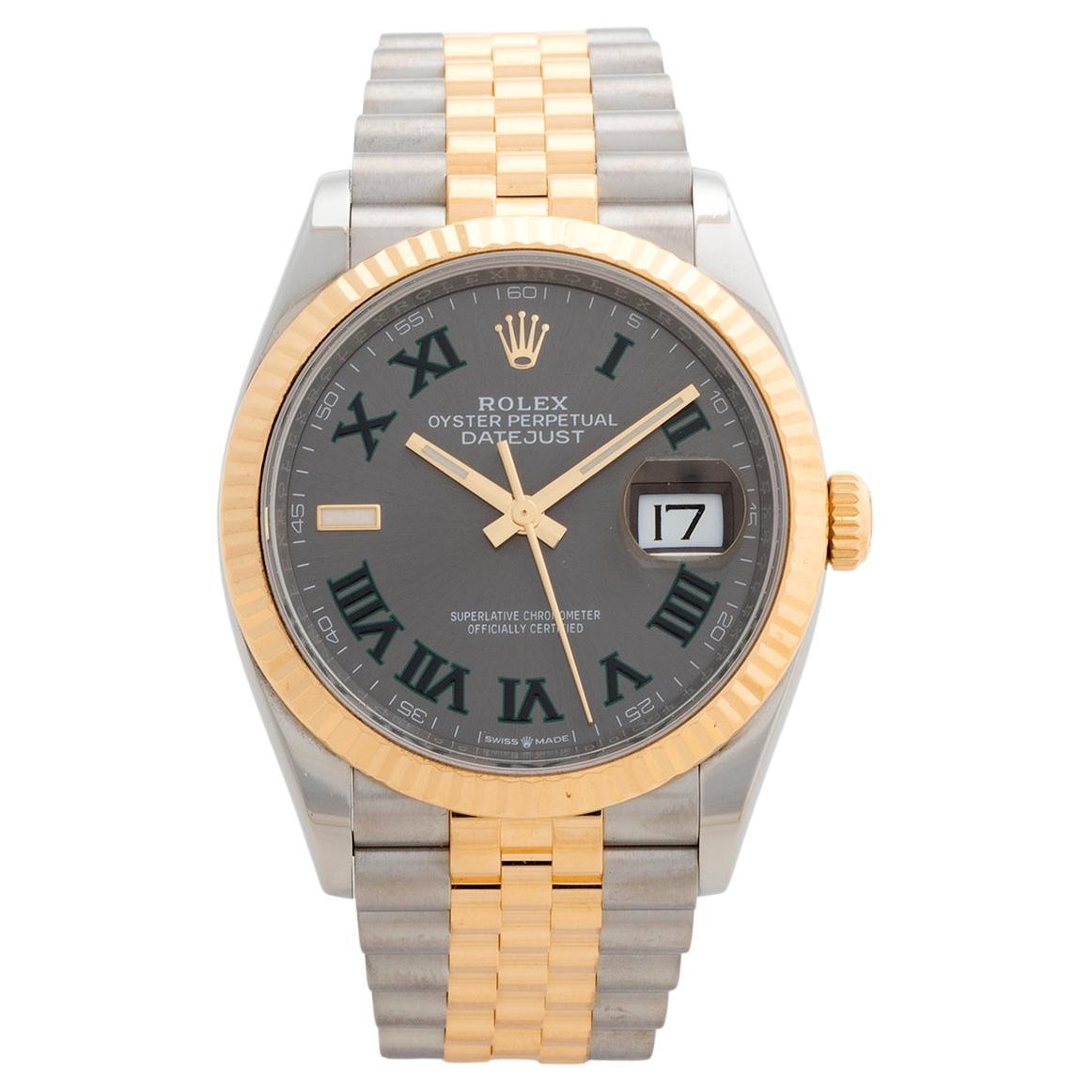 Our Rolex Datejust reference 126233 features a stainless steel and 18k yellow gold 36mm case with stainless steel and 18k yellow gold jubilee bracelet. This example has the 