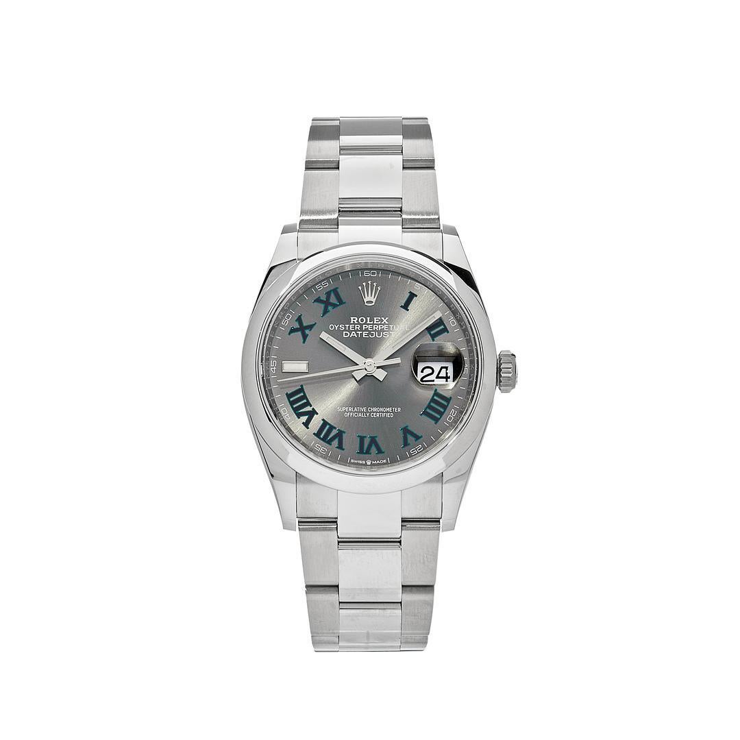 The Rolex Datejust is designed with a 36mm stainless steel case, highlighted with a smooth stainless steel bezel. It features a slate grey dial with green roman numerals, stainless steel hands and date display at 3 o'clock, protected by a