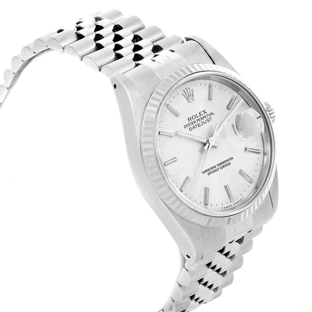 Rolex Datejust 36 Steel White Gold Silver Baton Dial Mens Watch 16234. Officially certified chronometer self-winding movement with quickset date function. Stainless steel oyster case 36 mm in diameter. Rolex logo on a crown. 18k white gold fluted