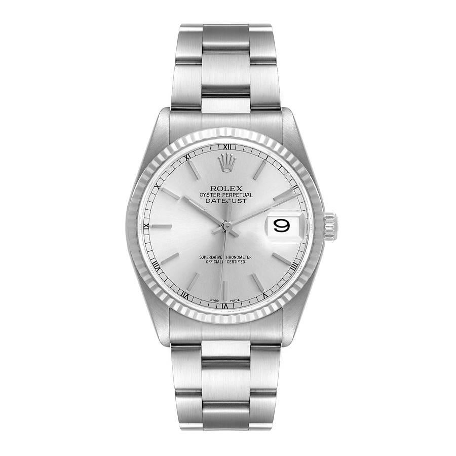 Rolex Datejust 36 Steel White Gold Silver Dial Mens Watch 16234 Box Papers. Officially certified chronometer self-winding movement. Stainless steel oyster case 36 mm in diameter. Rolex logo on a crown. 18k white gold fluted bezel. Scratch resistant