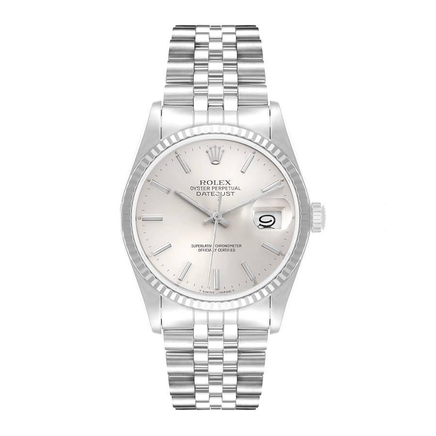 Rolex Datejust 36 Steel White Gold Silver Dial Mens Watch 16234. Officially certified chronometer self-winding movement. Stainless steel oyster case 36 mm in diameter. Rolex logo on a crown. 18k white gold fluted bezel. Scratch resistant sapphire