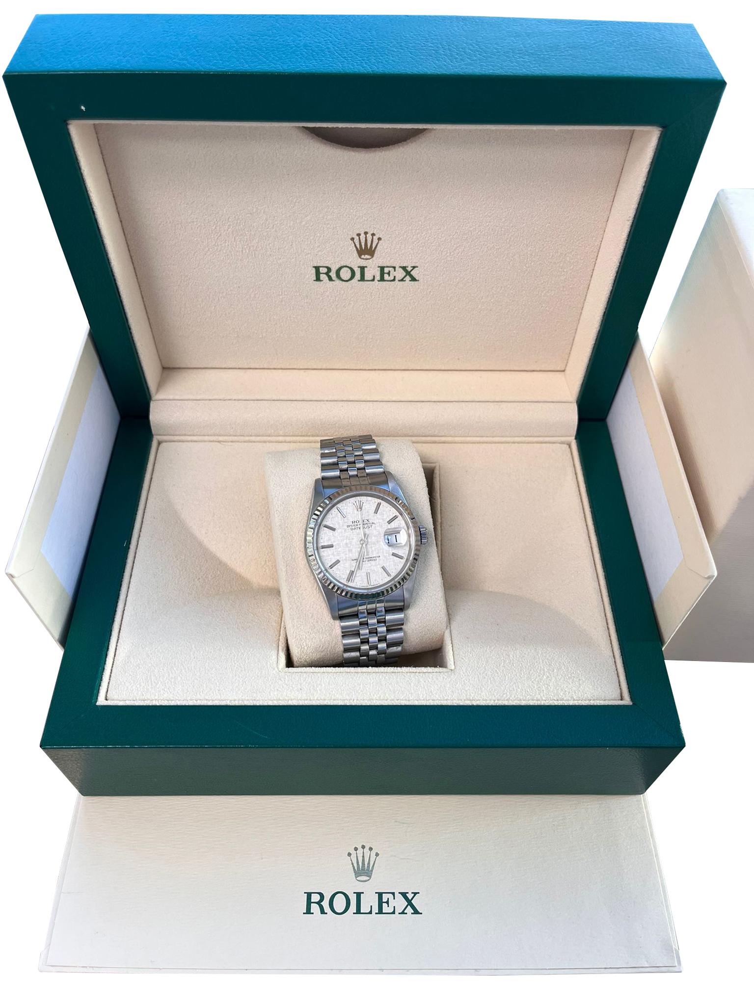 Rolex Datejust 36 Steel White Gold Silver Linen Dial Mens Watch 16234. Officially certified chronometer self-winding movement. Stainless steel oyster case 36 mm in diameter. Rolex logo on a crown. 18k white gold fluted bezel. Scratch-resistant
