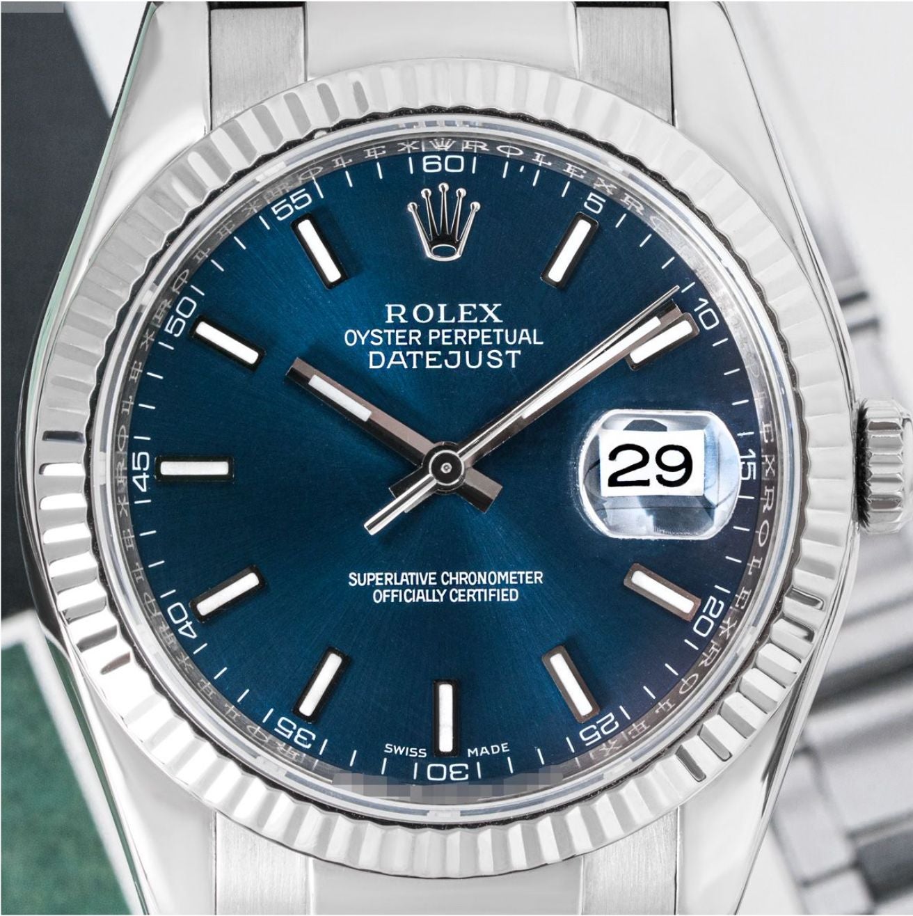 A white gold Datejust by Rolex. Featuring a blue dial with applied hour markers and a white gold fluted bezel. Fitted with a sapphire glass, a self-winding automatic movement and an original blue leather strap equipped with a Rolex white gold