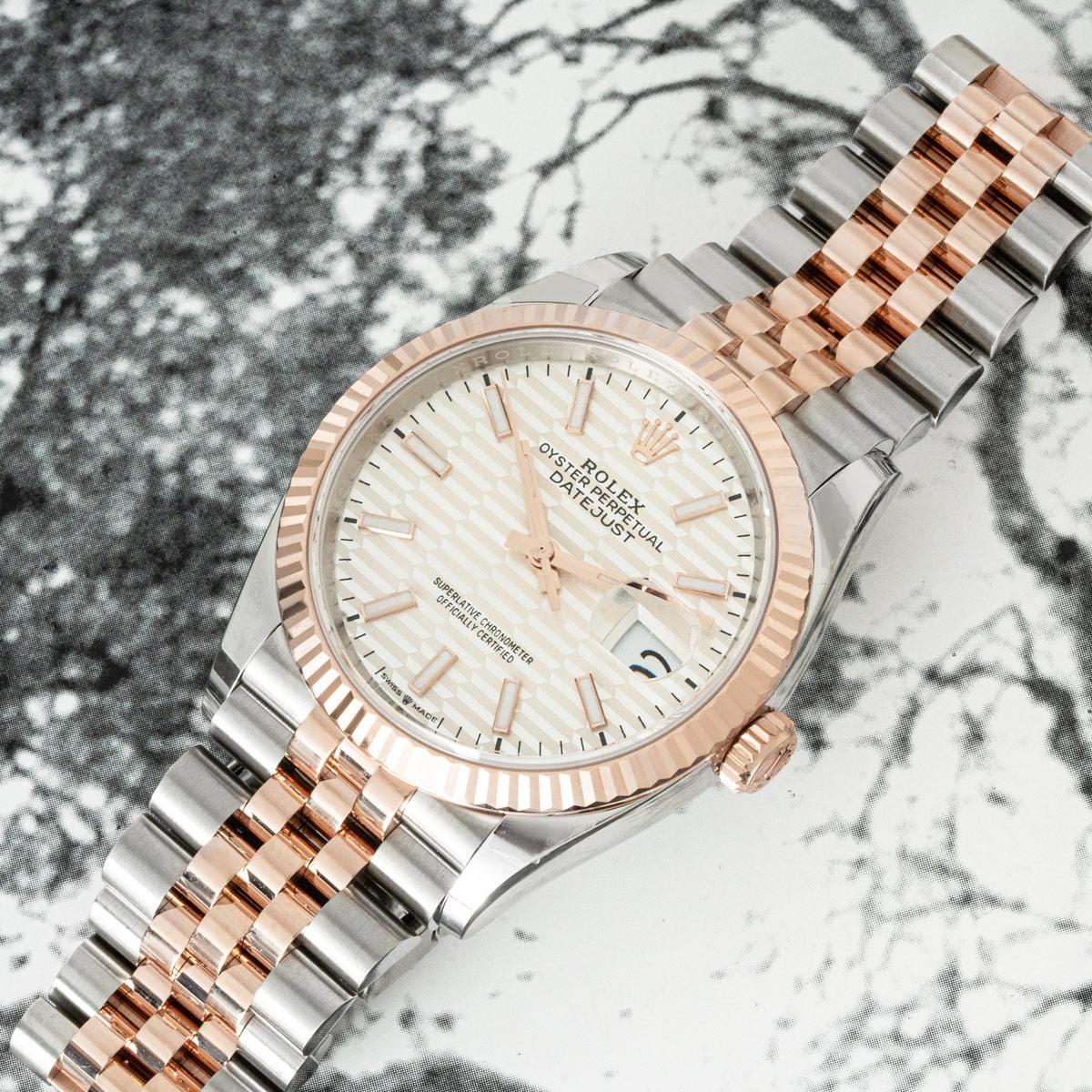 A Datejust 36 in stainless steel and rose gold by Rolex. Featuring the discontinued silver fluted motif dial complemented by a fluted rose gold bezel. The watch is presented on a Jubilee bracelet that is equipped with a folding Oysterclasp. Fitted